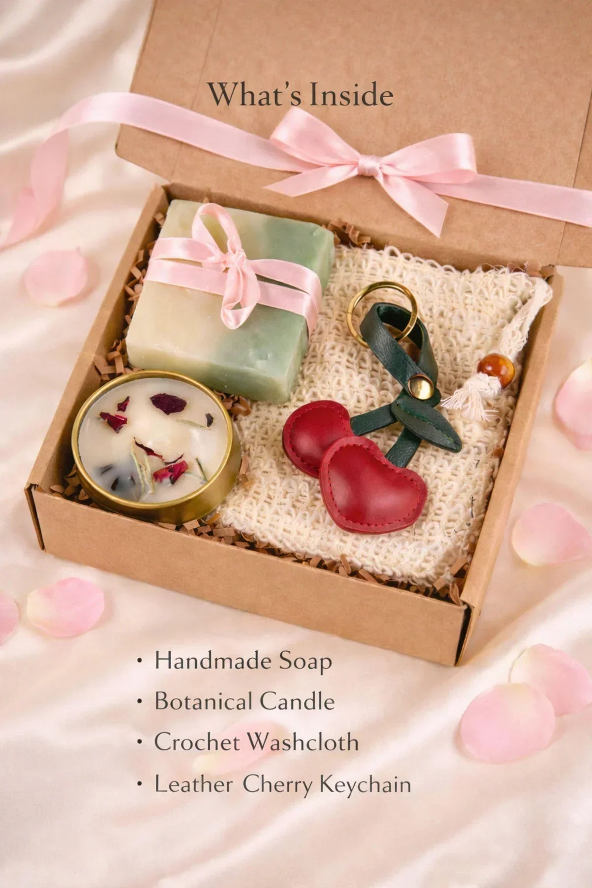 Thinking of You Gift Boxes with handmade soap, botanical candle, crochet washcloth, and leather cherry keychain inside a box.