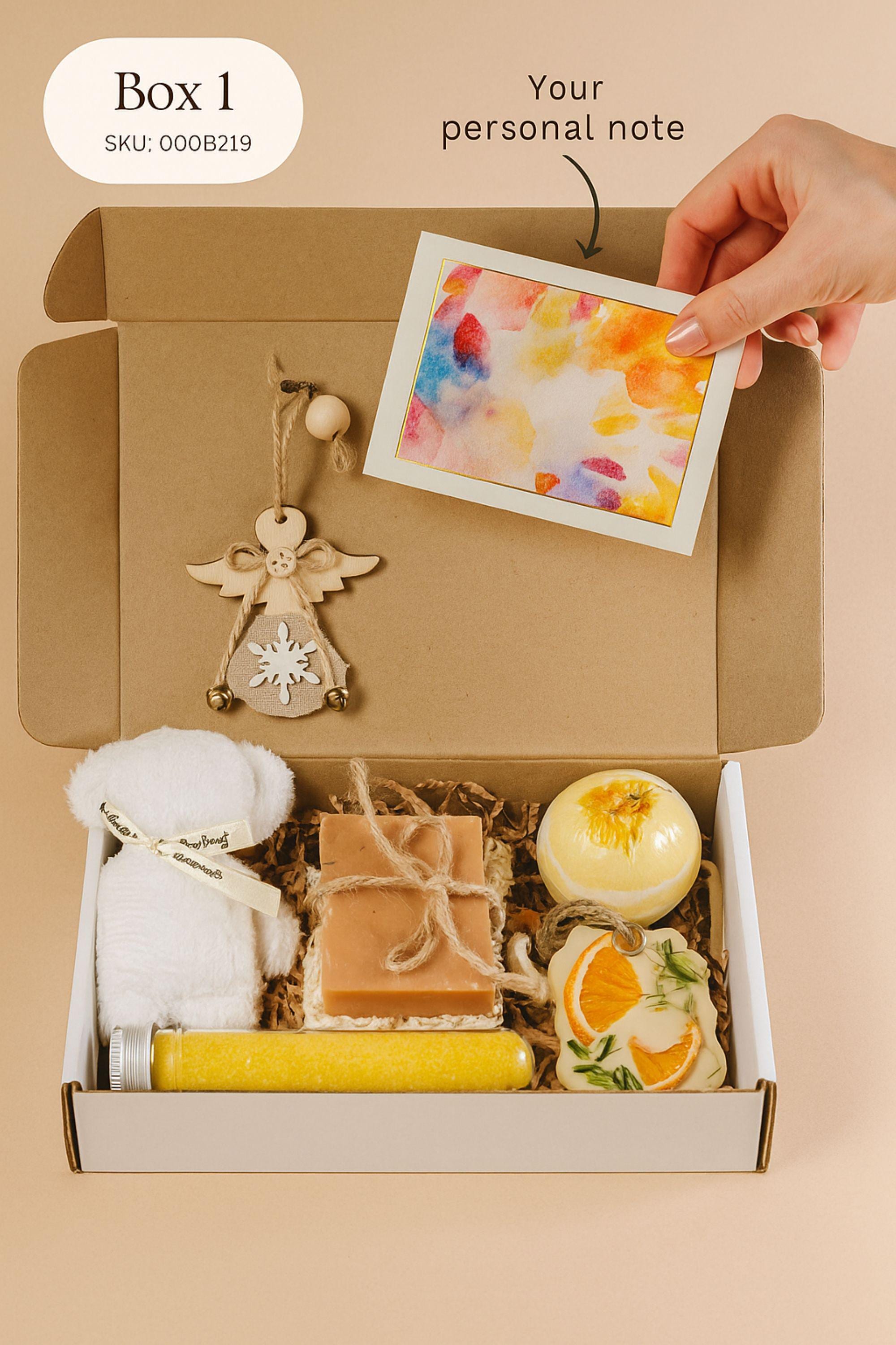 Christmas spa gift box for her with handmade soap, yellow bath bomb, citrus wax sachet, towel teddy bear, angel ornament, and aromatic bath salts. Cozy holiday self-care package for women, small Christmas gift, Secret Santa spa set, relaxation and pampering box for winter stress relief.