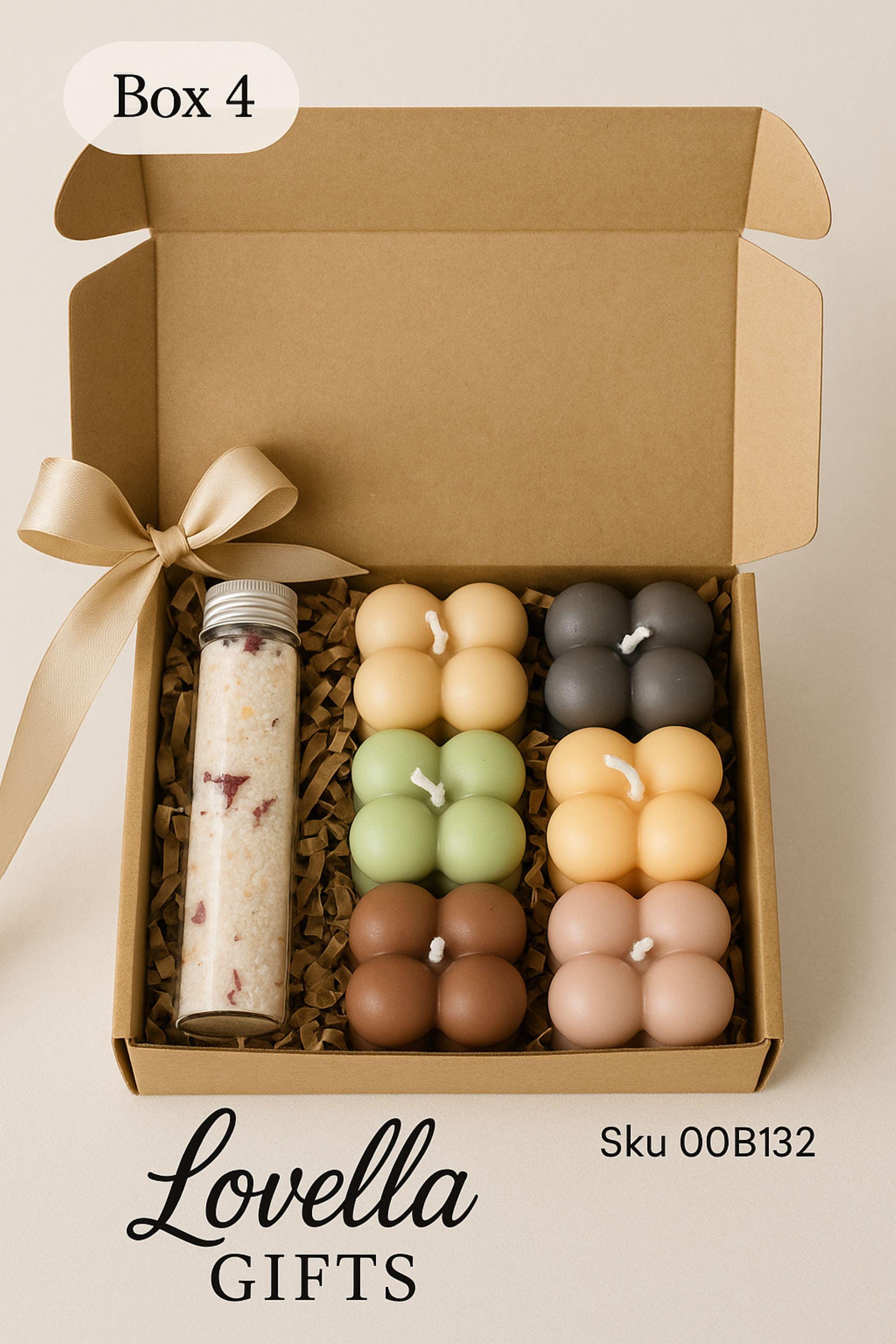 Open Christmas spa gift box with three bubble candles, two bath salts tubes, a green tree candle, rustic fabric ornaments, and a wooden Christmas tree decoration inside a kraft box with crinkle paper. Cozy holiday self-care set for women, handmade winter gift, small ready-to-gift Christmas box with candles, salts, and matchsticks.