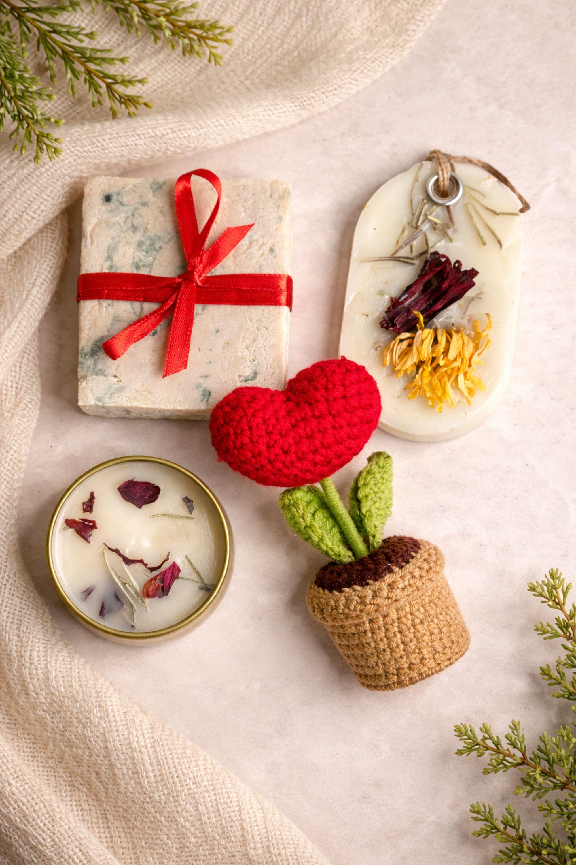 Thinking of you gift box with handmade soap tied with red ribbon, botanical candle in metal tin, wax sachet with dried flowers and crochet flower arranged inside a black gift box. Cozy comfort handmade gift for her, just because care package, small meaningful present for long distance support, encouragement, sympathy or thoughtful gesture. Gift ready handmade box designed to show care, warmth and attention.