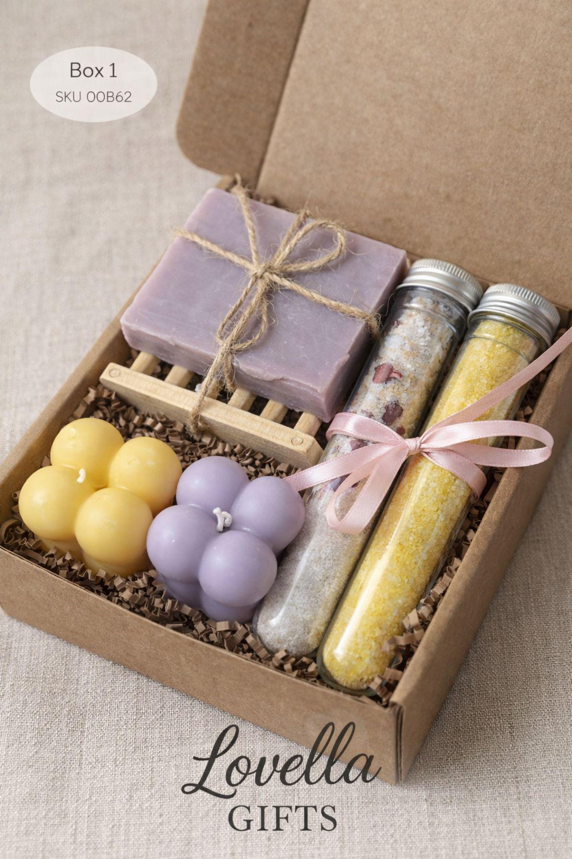 Open handmade gift box for best friend displayed on a bright, clean background, featuring colorful bubble candles, natural soap tied with twine, and two glass tubes of bath salts arranged neatly inside a small 6x6 inch kraft box. Cheerful gift for best friend designed as a fun and cozy handmade present, perfect for birthdays, celebrations, or everyday surprises.