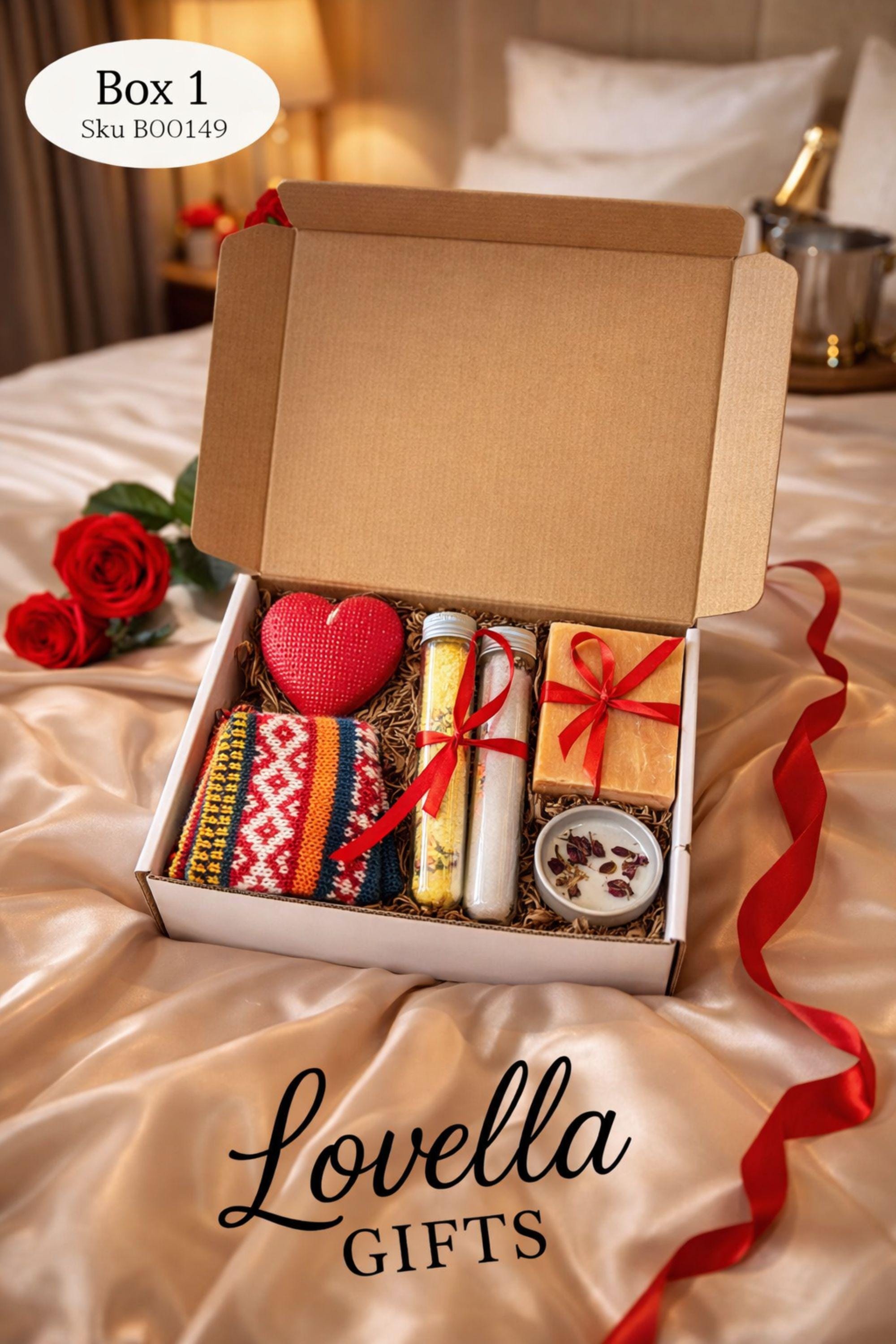 Cozy Valentine gift box with handmade soap tied with red ribbon, heart shaped candle, scented candle with dried flowers, bath salts in glass tubes, and knitted washcloth arranged in kraft gift box. Romantic self care gift for her, comfort care package, handmade Valentine’s Day gift, thinking of you box, ready to gift cozy relaxation set.
