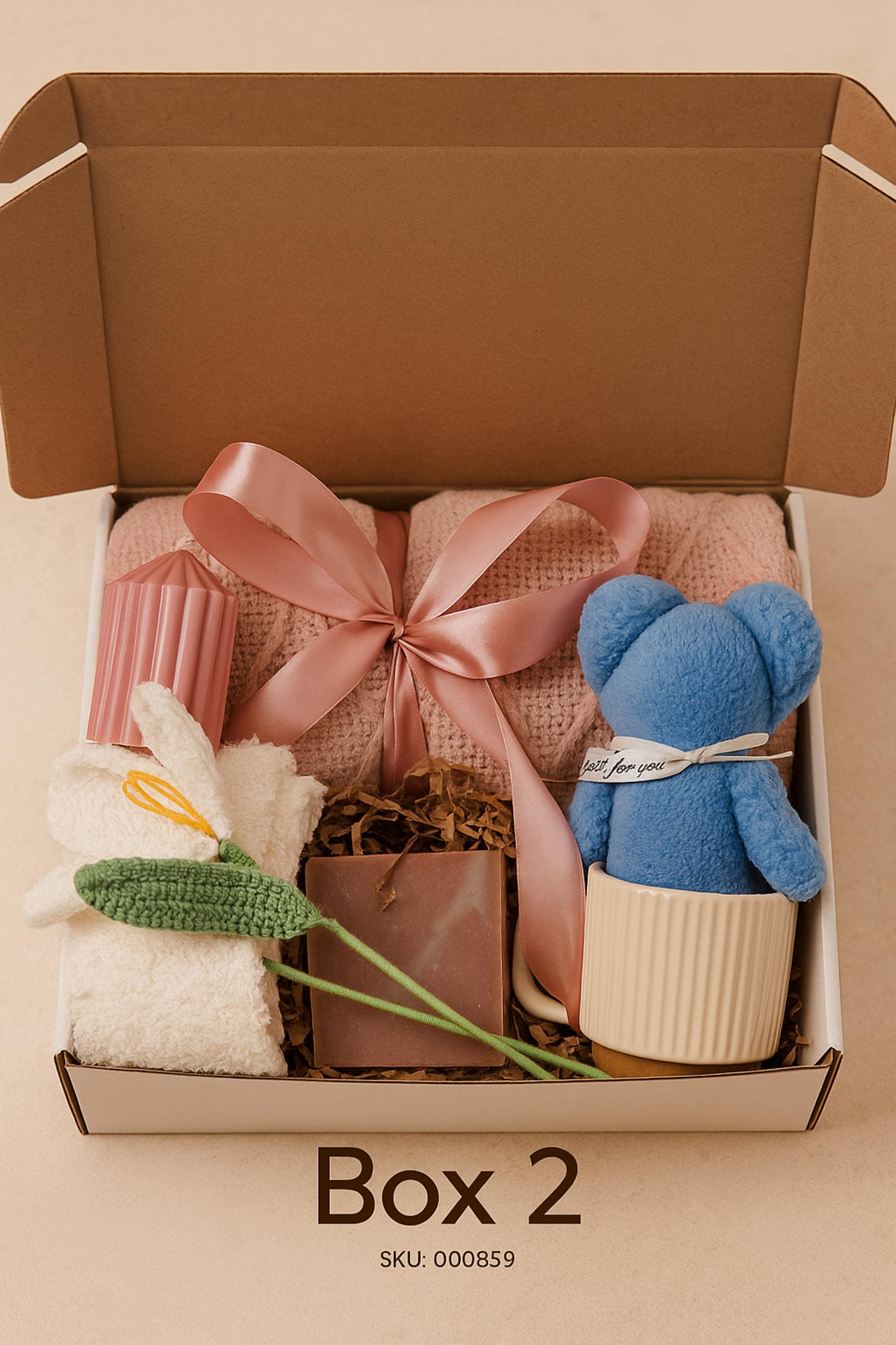 Self Love Reset gift box for women displayed on warm neutral linen background with soft window light, featuring yellow knit blanket, handmade natural soap, pastel bubble candles, citrus wax tablet with dried orange slices, ceramic mug and wooden soap dish. Emotional healing care package for new beginnings, self care gift for her, breakup recovery support box, thoughtful reset present.