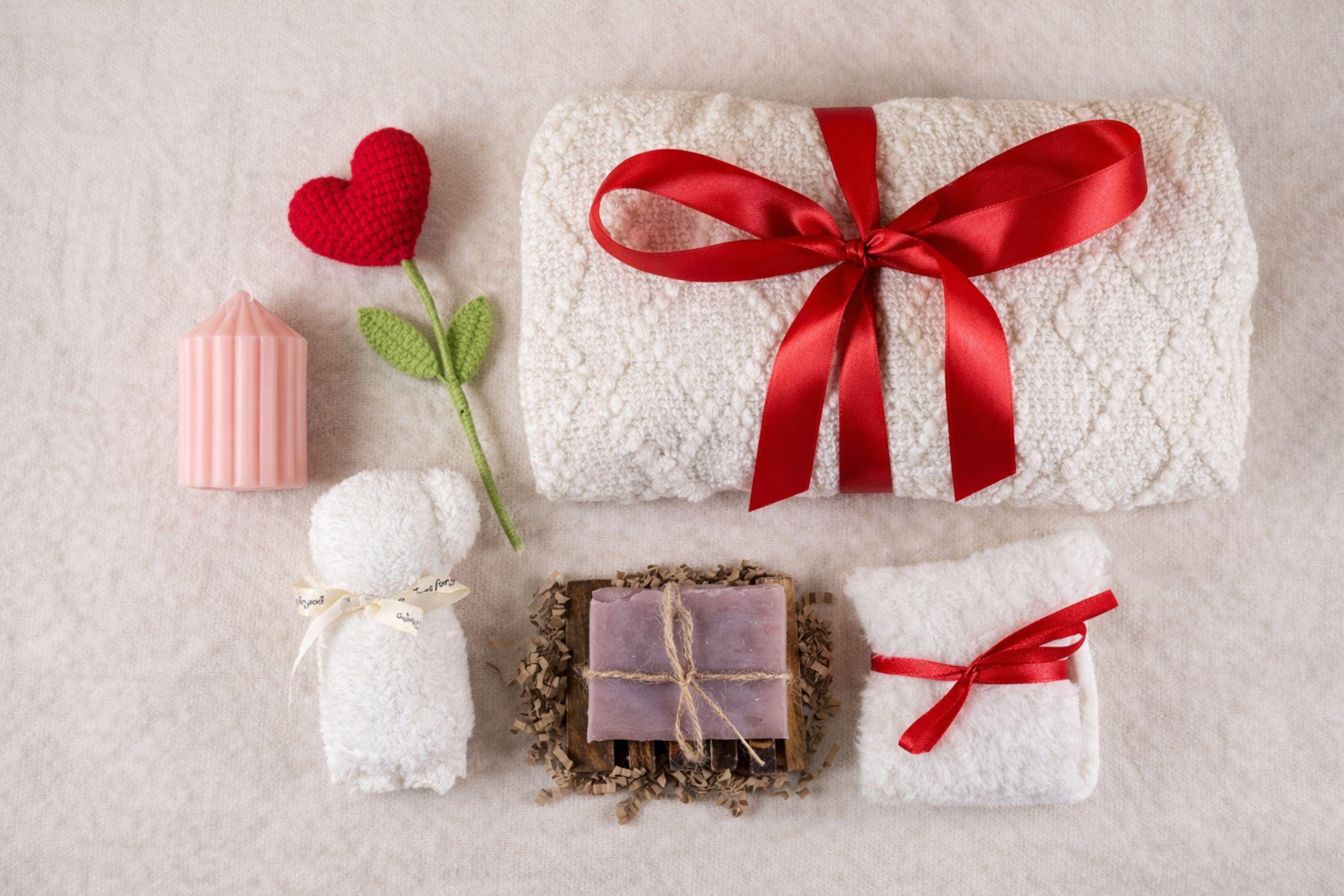 Valentine gift box with soft cozy blanket, candle, handmade soap, plush comfort items, and romantic heart details arranged in a gift-ready box. This cozy romantic Valentine care package is designed to send love, warmth, and comfort, perfect for long distance Valentine gifting, self love moments, or a thoughtful romantic surprise for her.