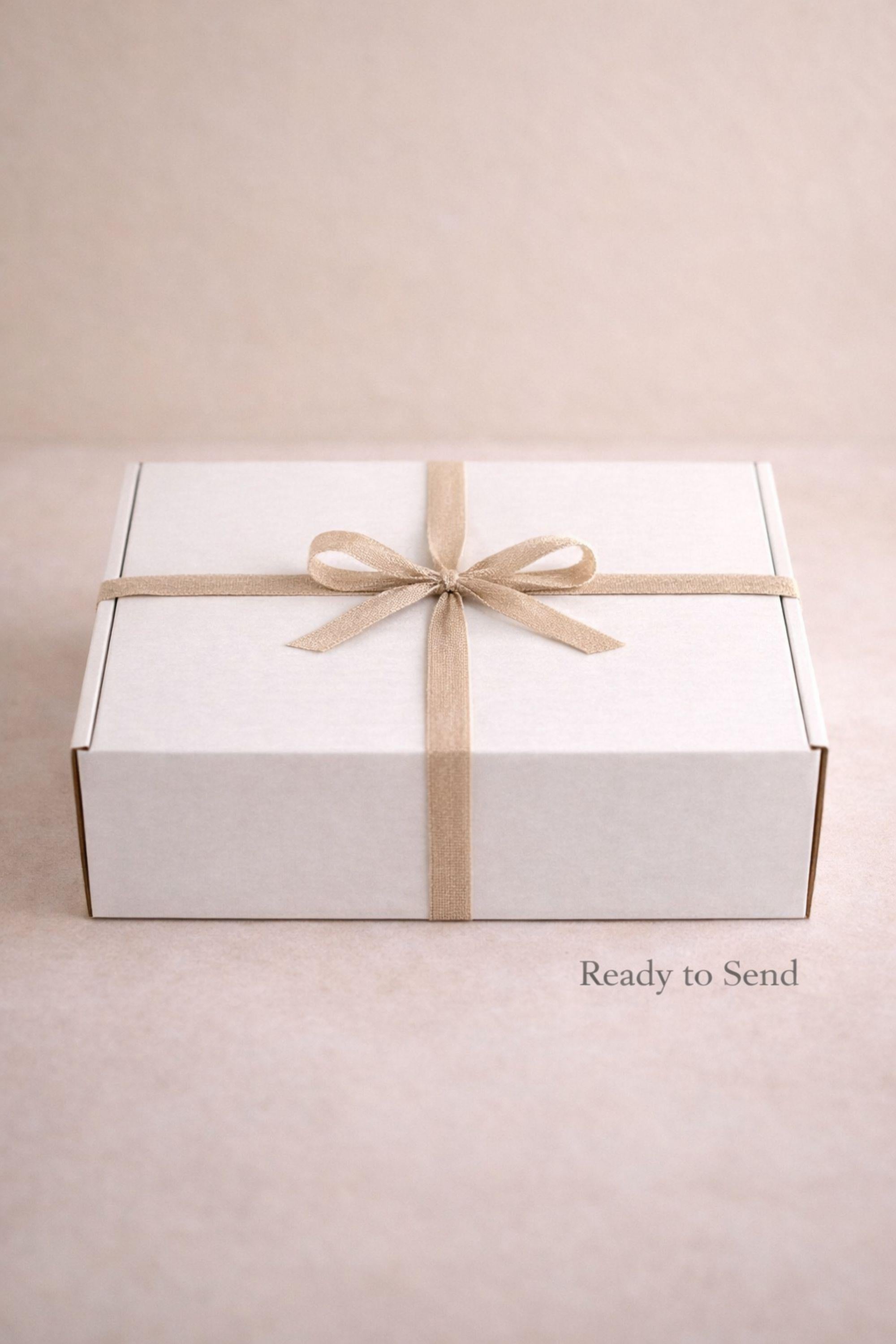 Thinking of You care package gift box featuring cozy knit blanket, handmade pillar candle on textured base, artisan soap with wooden holder, ribbed ceramic mug with spoon, beautifully arranged in a large white gift box. Comfort gift for women, sympathy support box, get well soon present, self care package, cozy curated gift ready to send.