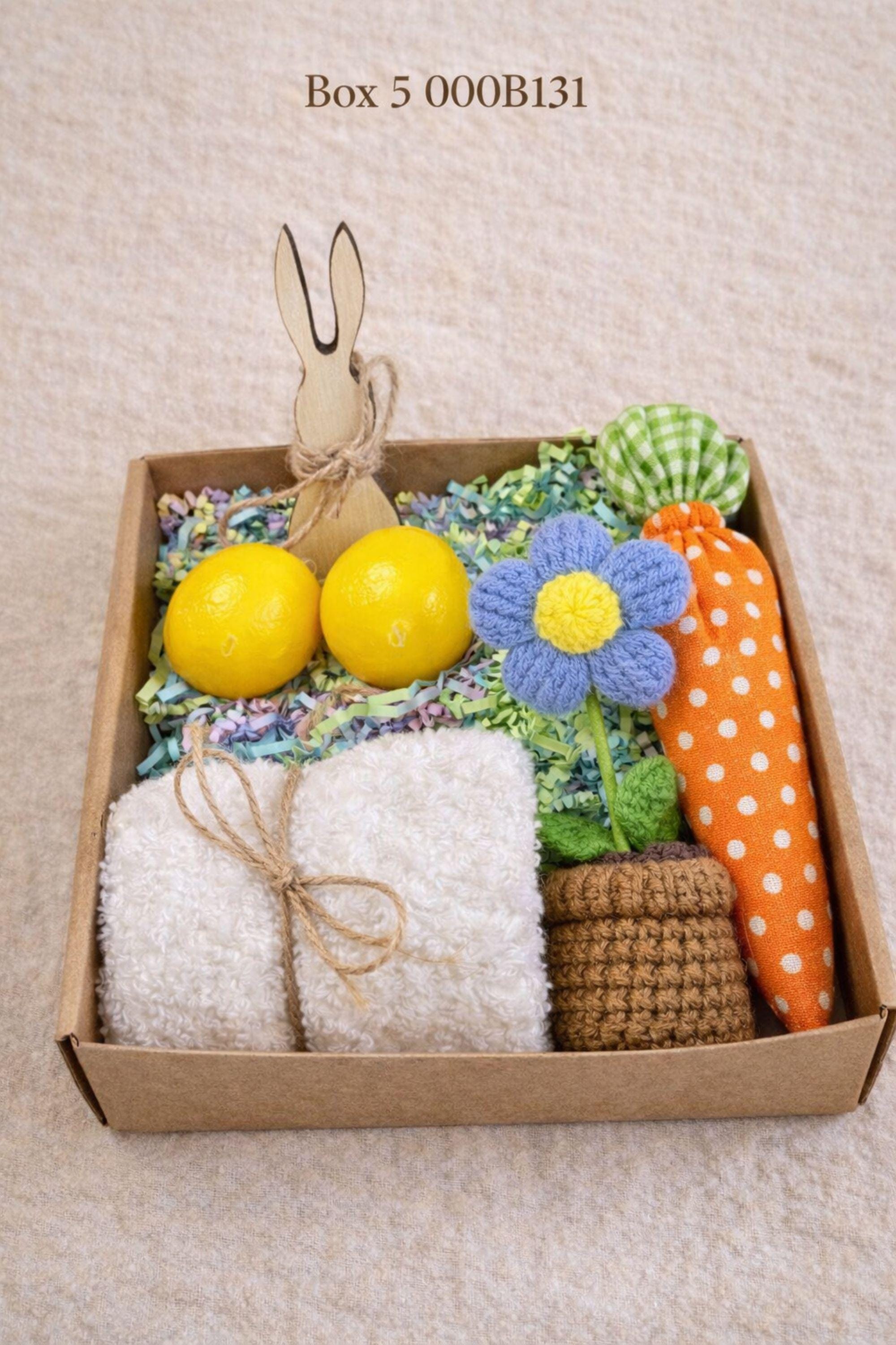small easter gift box with wooden bunny decoration, crochet sunflower in pot, handmade botanical wax sachet, mini easter basket with eggs, soft neutral cloth wrapped with twine, colorful paper filler, spring themed gift box for women, ready to gift easter care package, cozy handmade spring gift set, pastel aesthetic small gift box