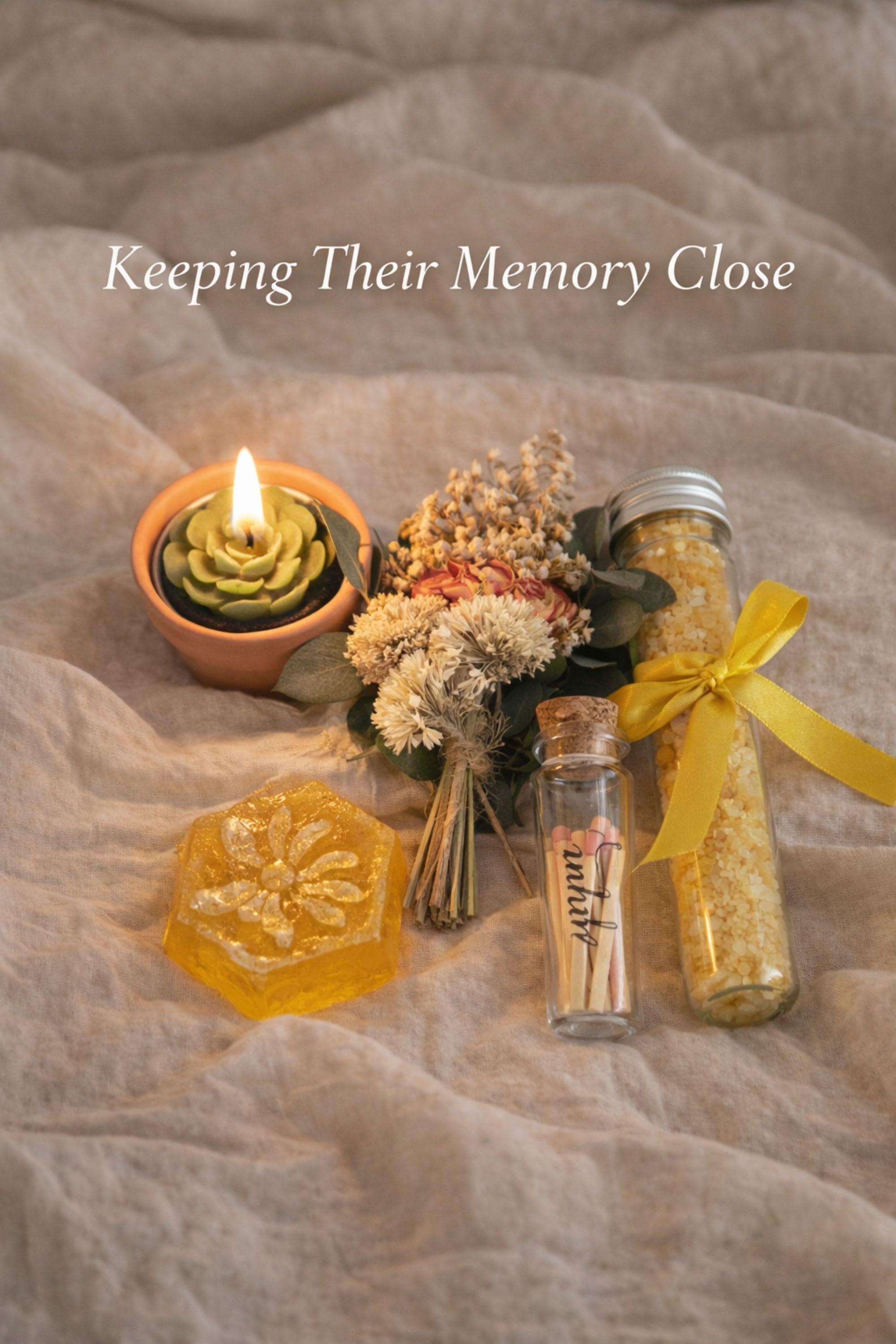 Pet loss sympathy gift box with memorial candle, honey soap, dried flowers, bath salts and matches arranged in elegant black gift box. Comfort care package designed as dog or cat memorial gift for grieving pet owner. Thoughtful pet bereavement gift with remembrance candle and self care elements to offer support after the loss of a beloved pet.