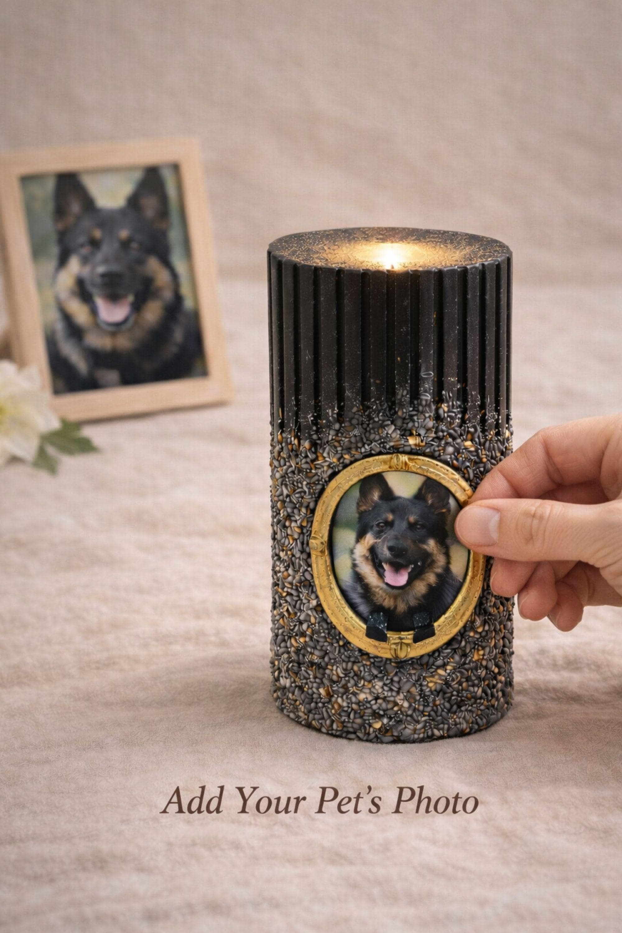 Pet memorial candle with personalized dog photo in a vintage gold frame, ribbed black candle with stone texture and gold accents, lit flame on neutral linen background, pet loss sympathy gift and dog remembrance candle honoring a beloved pet.