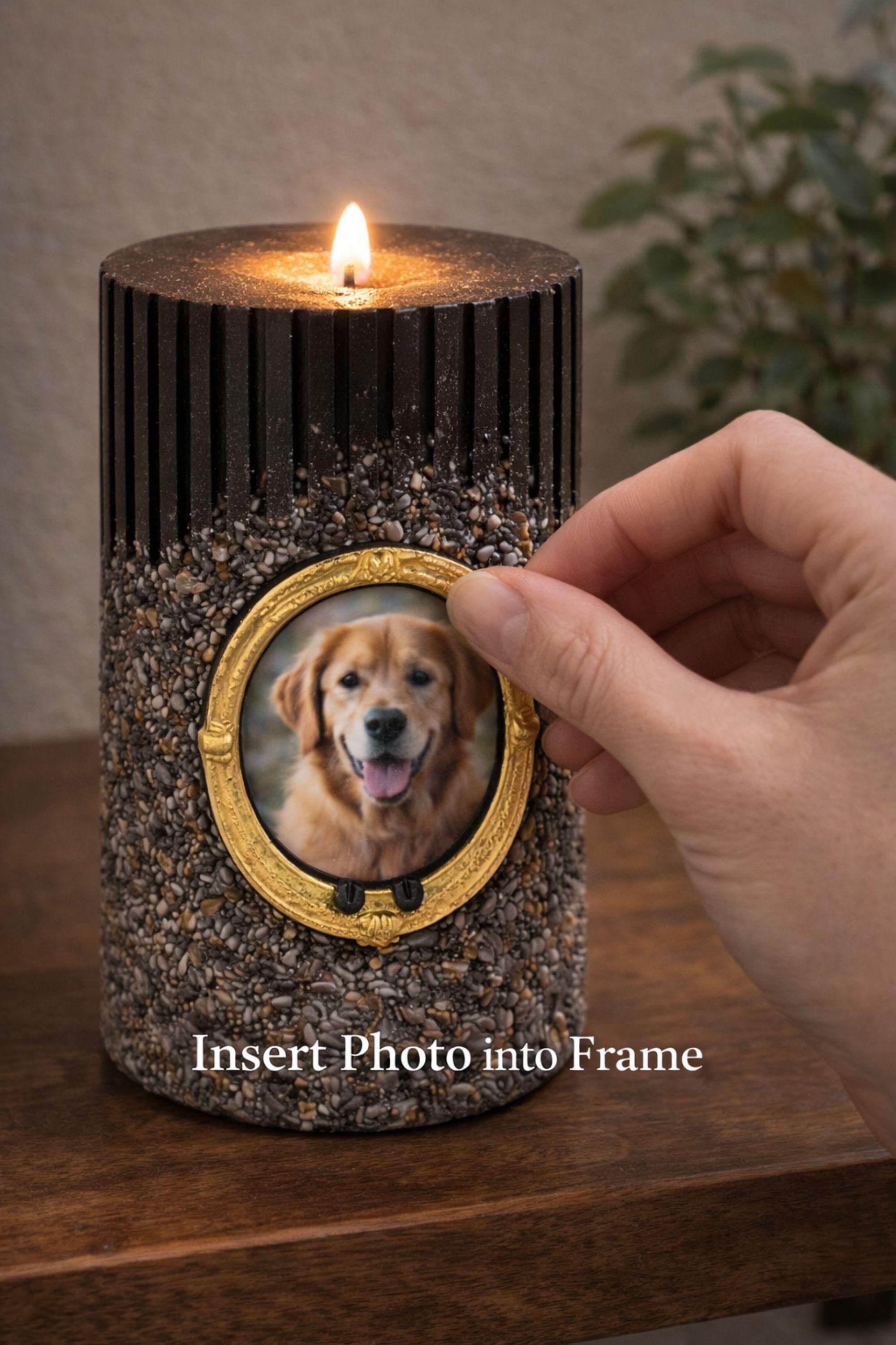 Personalized pet memorial candle with dog photo inside a gold oval frame. Black textured candle with stone finish designed as a pet loss sympathy gift and remembrance keepsake honoring a beloved dog or pet.