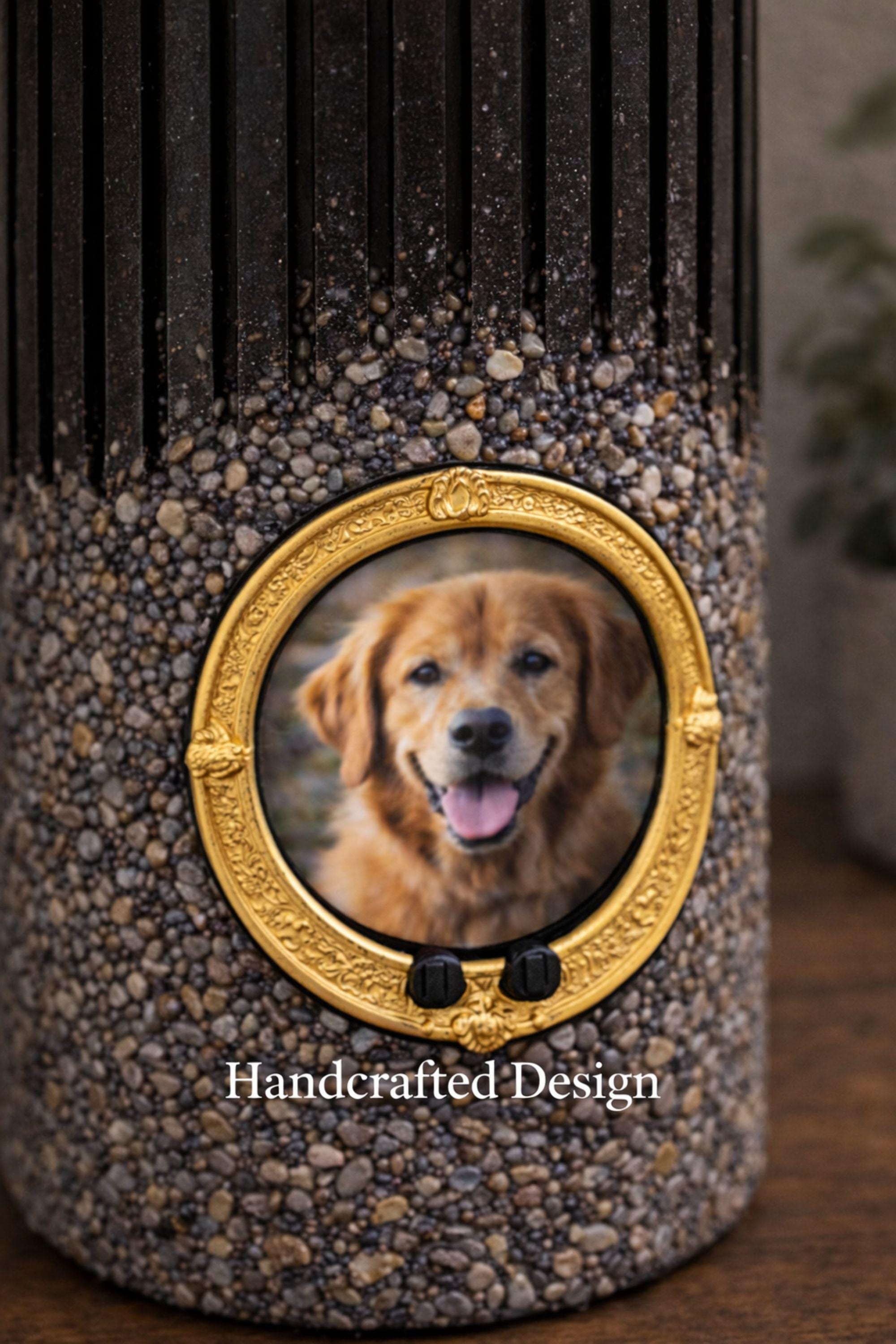 Personalized pet memorial candle with dog photo inside a gold oval frame. Black textured candle with stone finish designed as a pet loss sympathy gift and remembrance keepsake honoring a beloved dog or pet.
