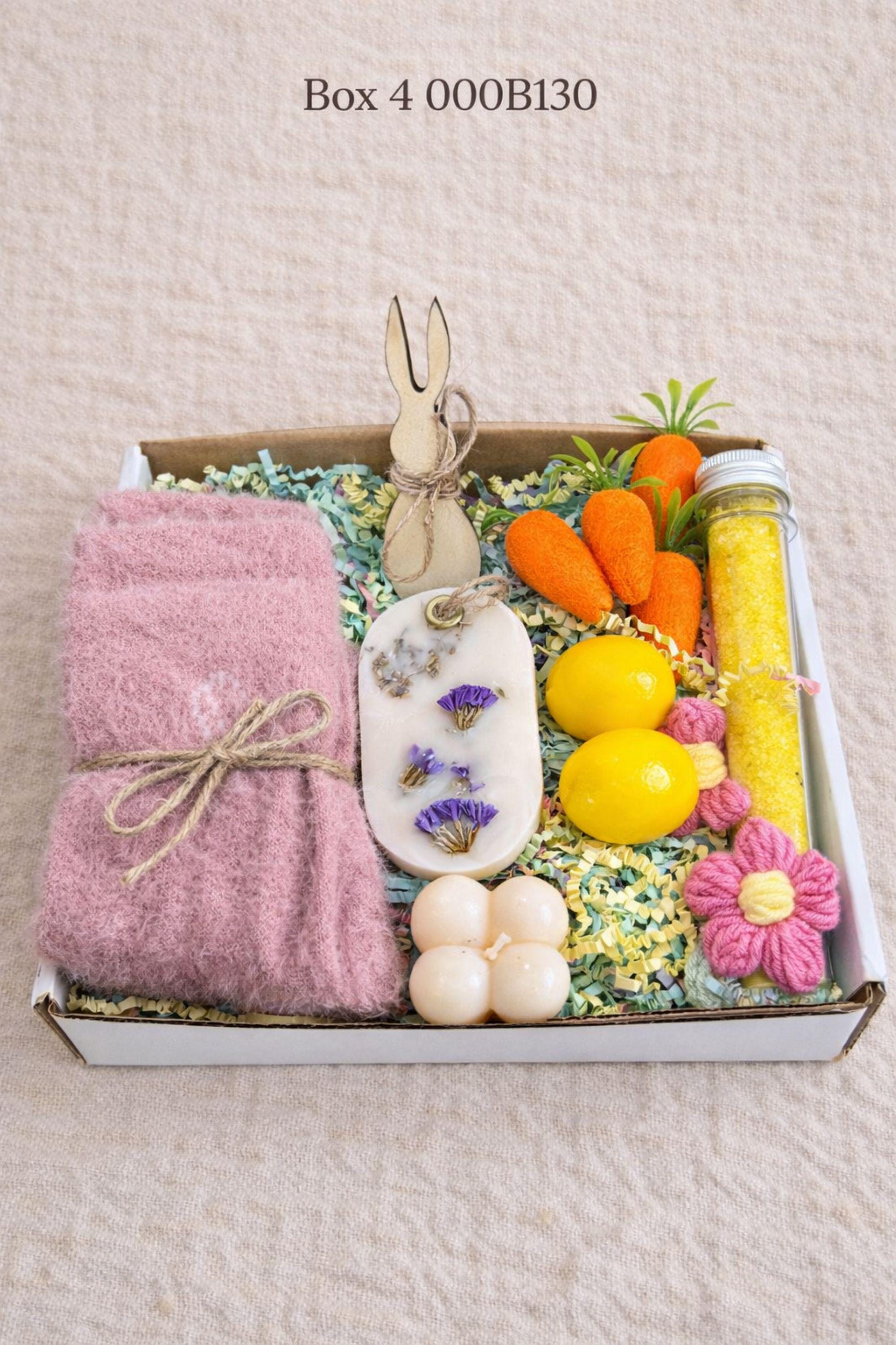 small easter gift box with wooden bunny decoration, crochet sunflower in pot, handmade botanical wax sachet, mini easter basket with eggs, soft neutral cloth wrapped with twine, colorful paper filler, spring themed gift box for women, ready to gift easter care package, cozy handmade spring gift set, pastel aesthetic small gift box