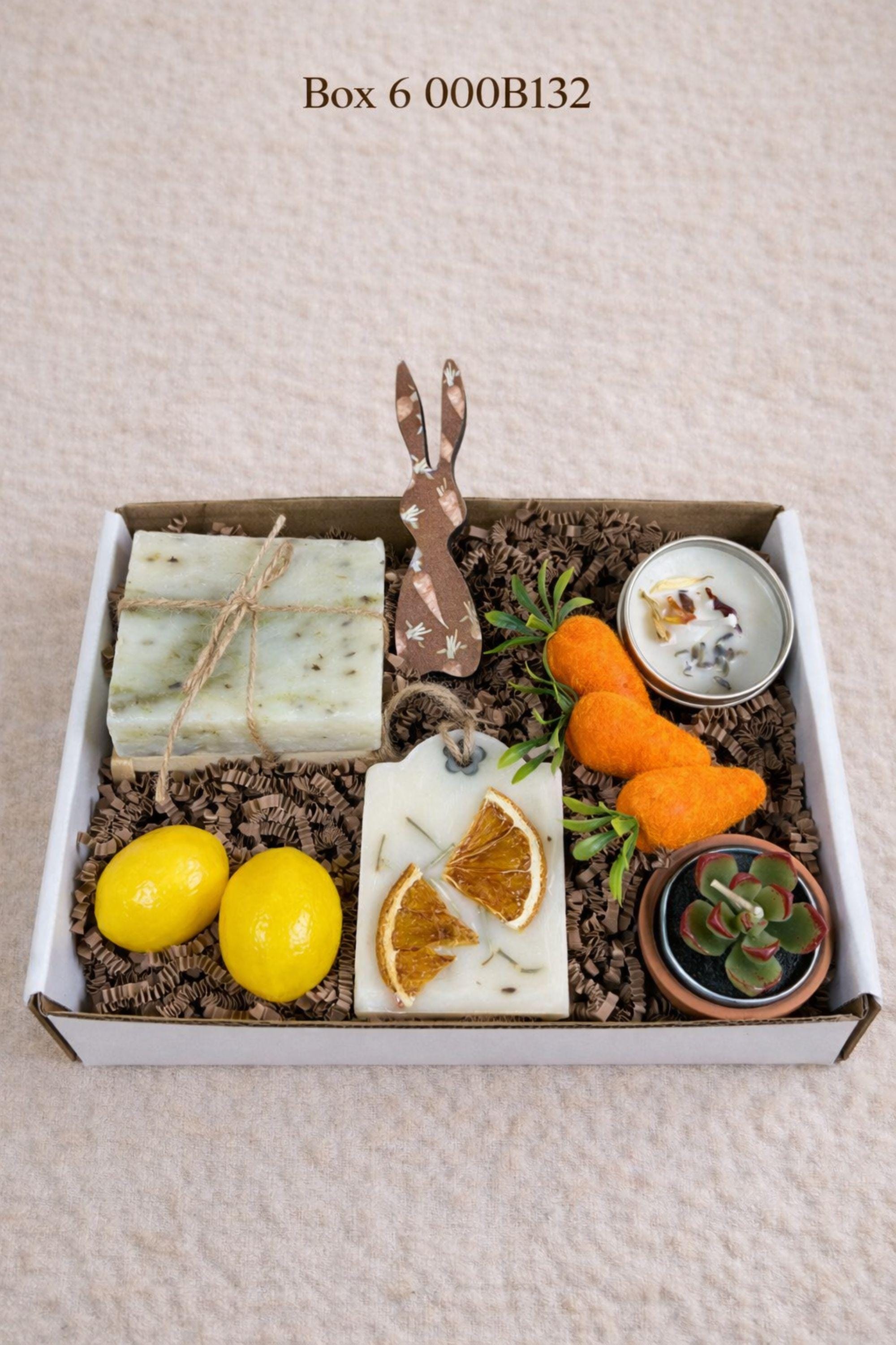 small easter gift box with wooden bunny decoration, crochet sunflower in pot, handmade botanical wax sachet, mini easter basket with eggs, soft neutral cloth wrapped with twine, colorful paper filler, spring themed gift box for women, ready to gift easter care package, cozy handmade spring gift set, pastel aesthetic small gift box