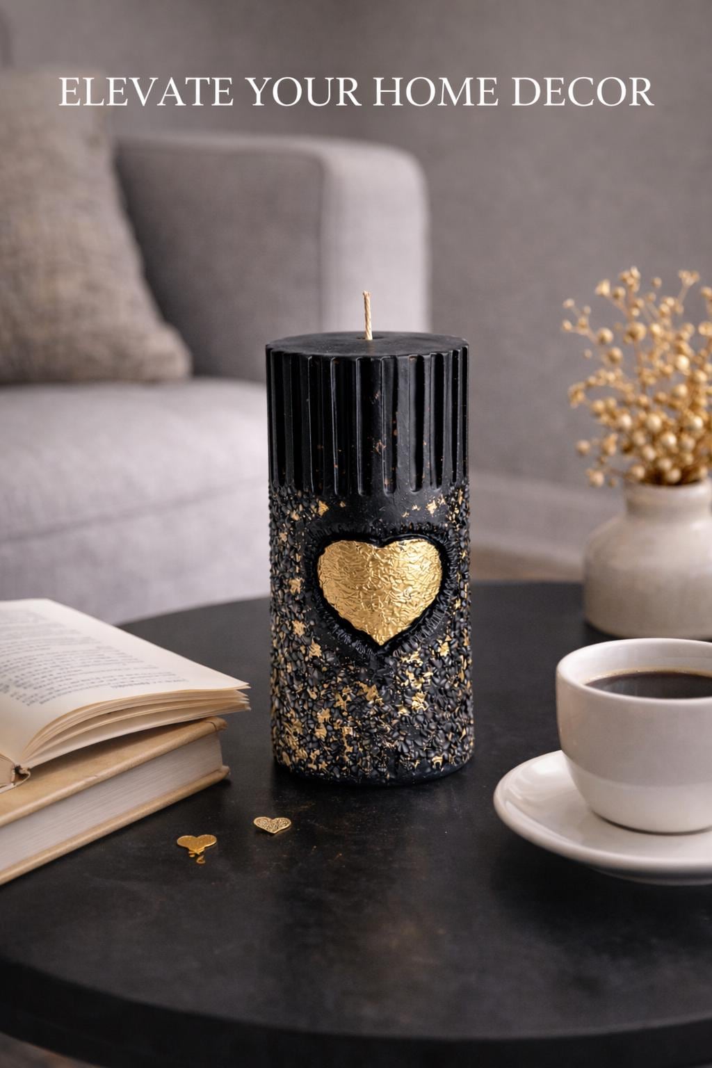 Black gold sculptural candle on coffee table with book and coffee, modern home decor candle, luxury decorative candle, minimalist interior styling, aesthetic statement candle for living room decor