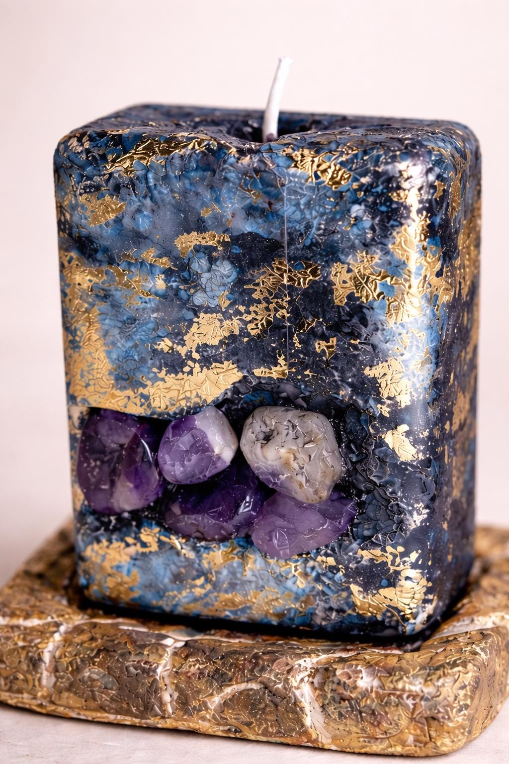 Close up amethyst crystal candle with 24K gold leaf detail texture luxury handmade candle spiritual decor minimal aesthetic