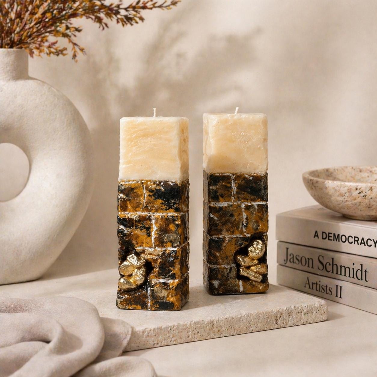 hand holding luxury candle showing scale and texture designer candle