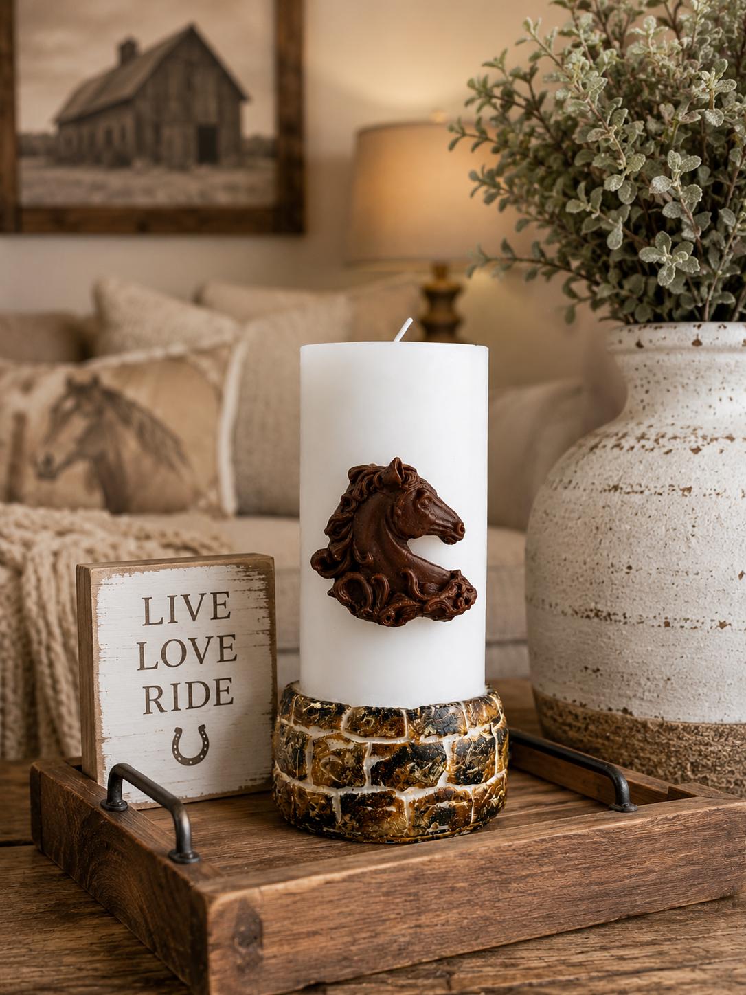 Decorative horse candle displayed in a cozy farmhouse interior, featuring a detailed brown horse relief on a white pillar candle, styled with rustic wood accents, neutral décor, and warm country-inspired home furnishings.