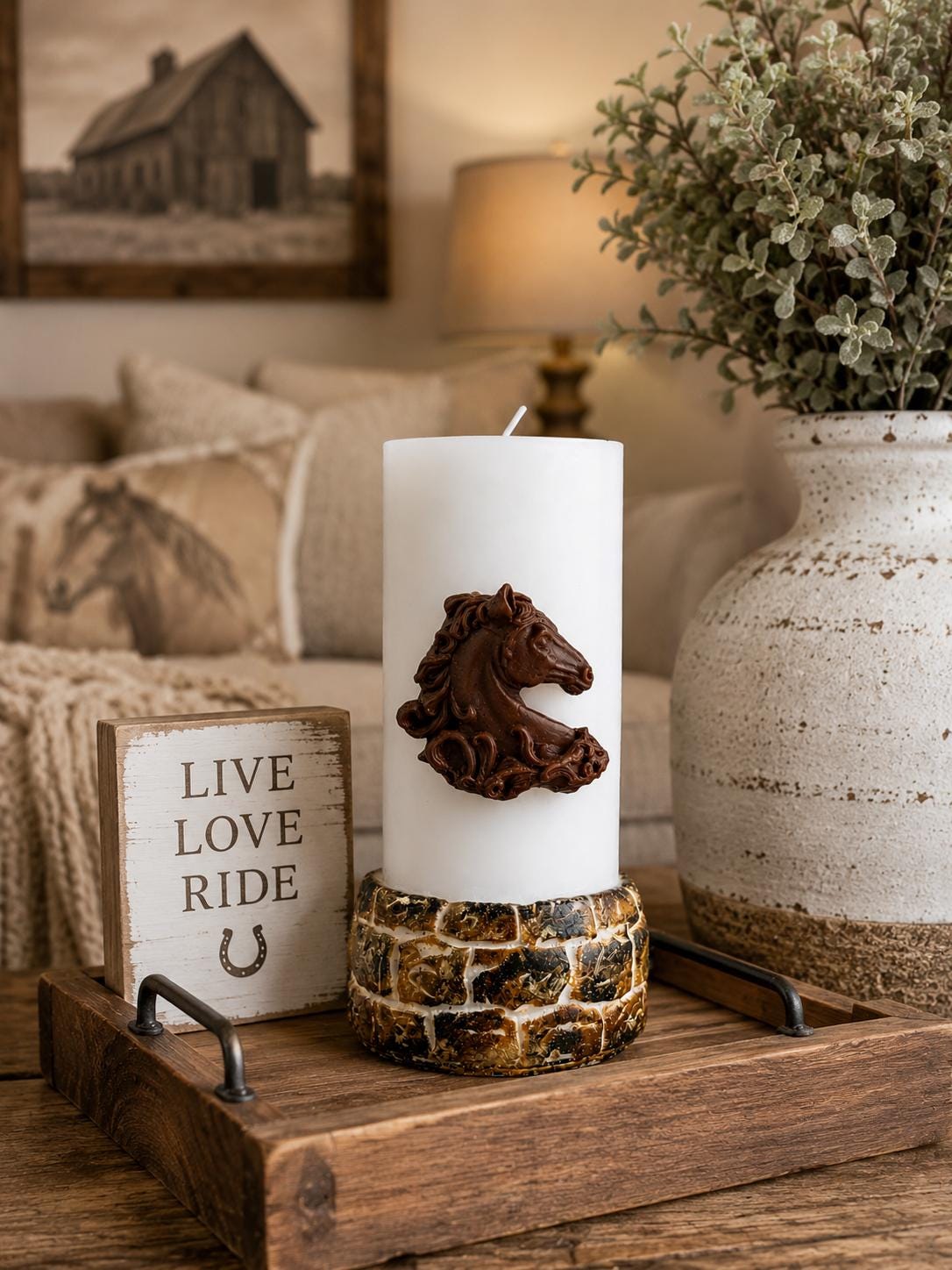 Horse Lover Gift candle displayed in a cozy farmhouse interior with a detailed brown horse relief on a white pillar candle, styled with rustic wood accents, neutral decor, warm country-inspired furnishings, and equestrian home decor details.