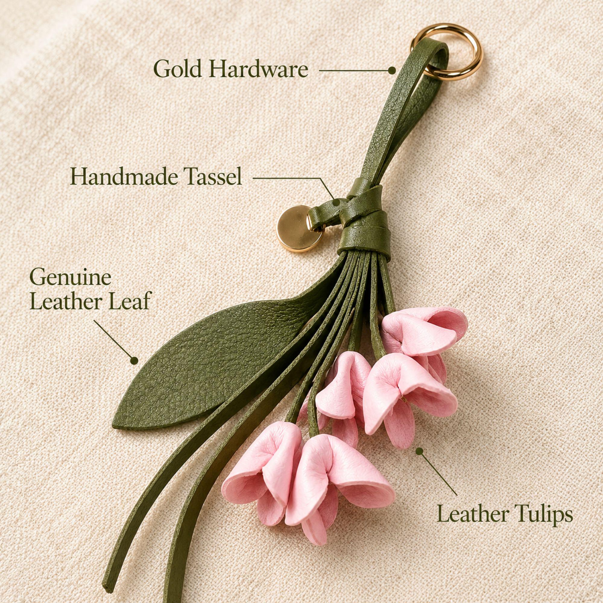 Handmade leather tulip bag charm featuring five soft blush pink leather tulip flowers, an olive green leather leaf, handmade leather tassel, and gold hardware. Floral purse charm designed for tote bags, handbags, shoulder bags, backpacks, straw bags, beach bags, and everyday purses. Lightweight botanical leather keychain inspired by spring flowers. A thoughtful handmade gift for women, moms, sisters, daughters, bridesmaids, birthdays, Mother's Day, and spring fashion lovers.