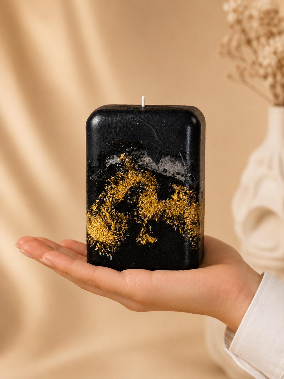 Black Gold Decorative Candle handmade luxury candle with gold leaf accents, sculptural black design, modern coffee table decor, and elegant housewarming gift styling.