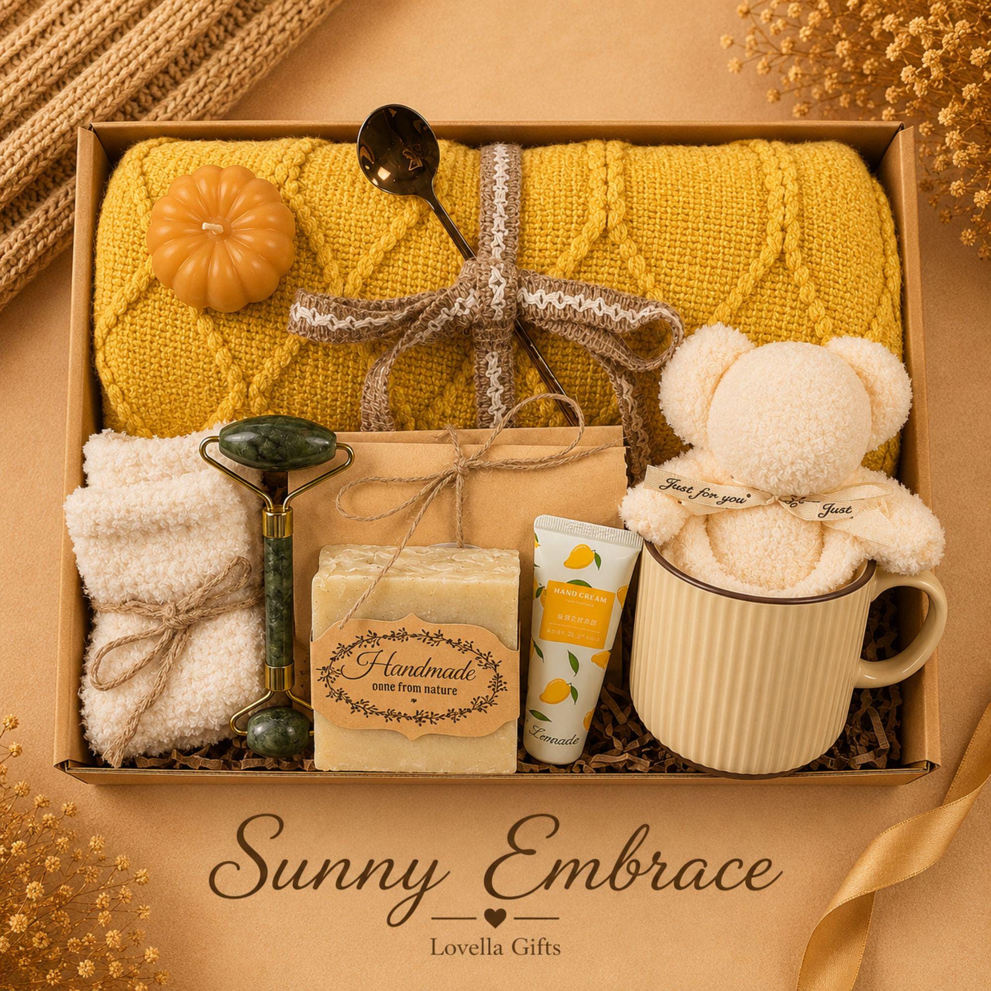 Thanksgiving gift box for women featuring a cozy knit blanket, handmade pumpkin soy candle, ceramic mug, artisan soap, decorative glass match bottle, plush teddy bear and cozy autumn socks in boutique gift packaging. Thanksgiving hostess gift basket perfect for hostess appreciation, thank you gifts, fall care packages, cozy blanket gifts, autumn self care, holiday gatherings, and seasonal gifts for mom, grandma, sister, friend, teacher or coworker.