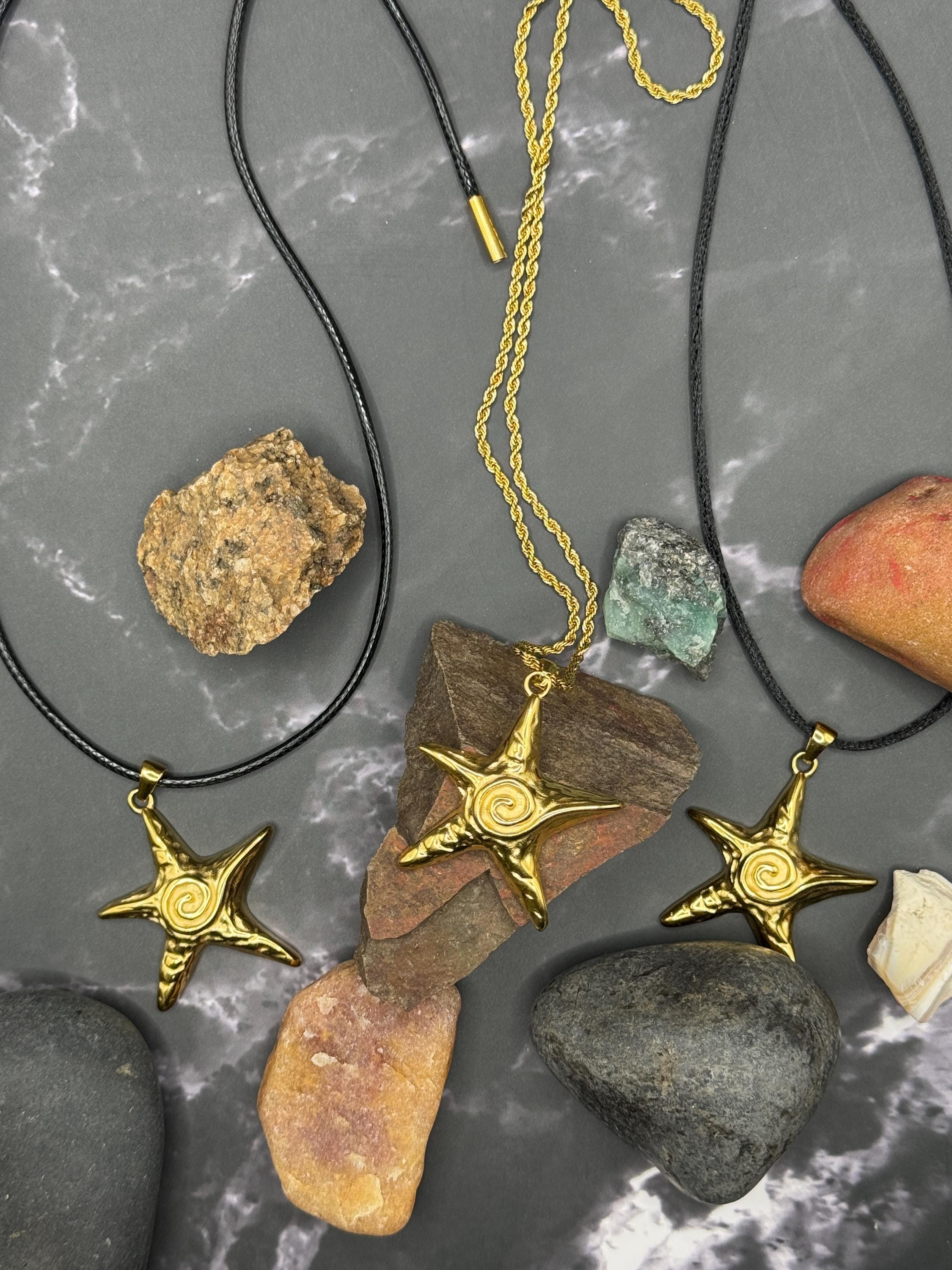 Gold Star Necklace options with chain, choker, and leather cords displayed with natural stones.