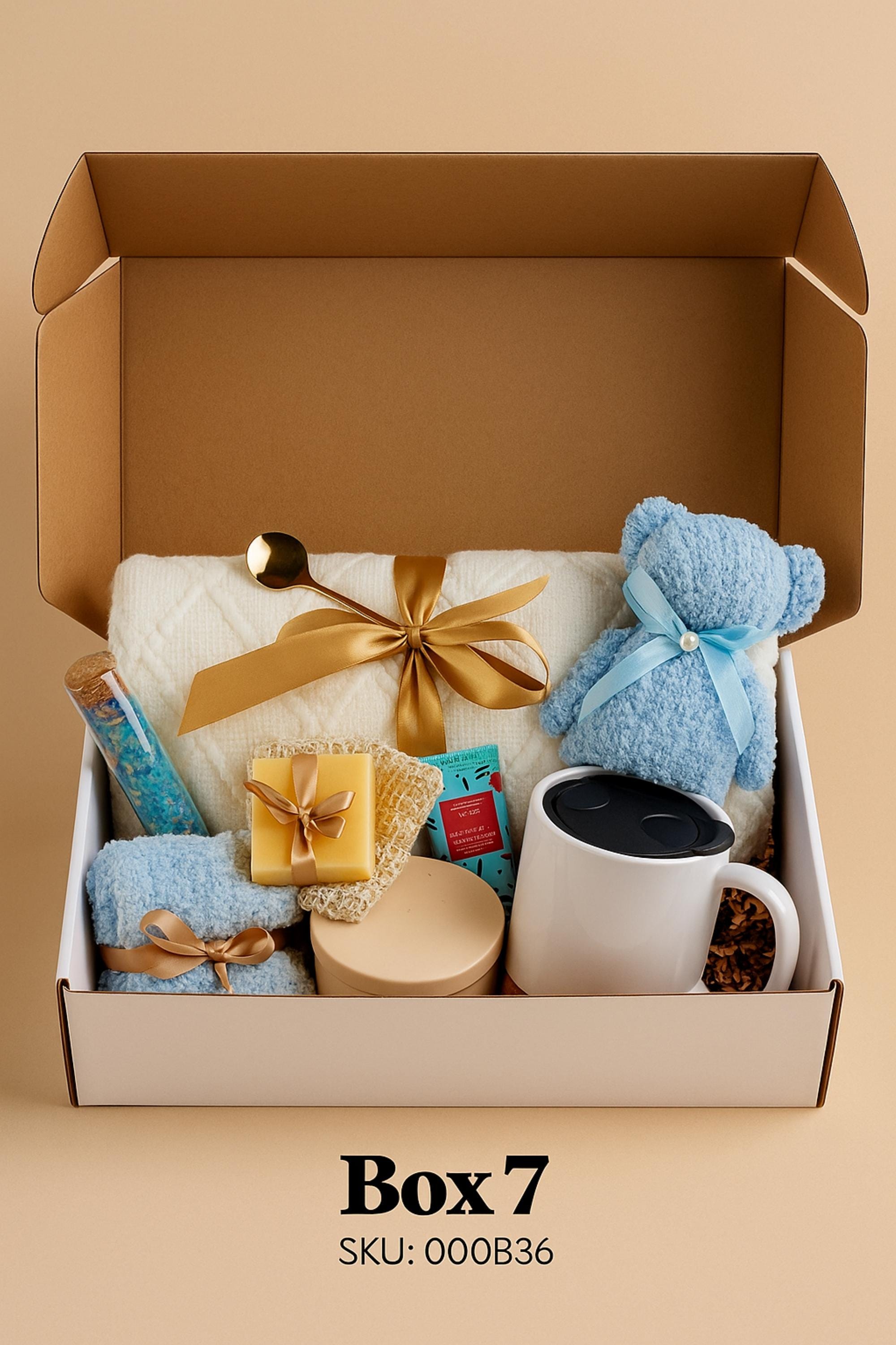 Self Love Reset gift box for women displayed on warm neutral linen background with soft window light, featuring yellow knit blanket, handmade natural soap, pastel bubble candles, citrus wax tablet with dried orange slices, ceramic mug and wooden soap dish. Emotional healing care package for new beginnings, self care gift for her, breakup recovery support box, thoughtful reset present.