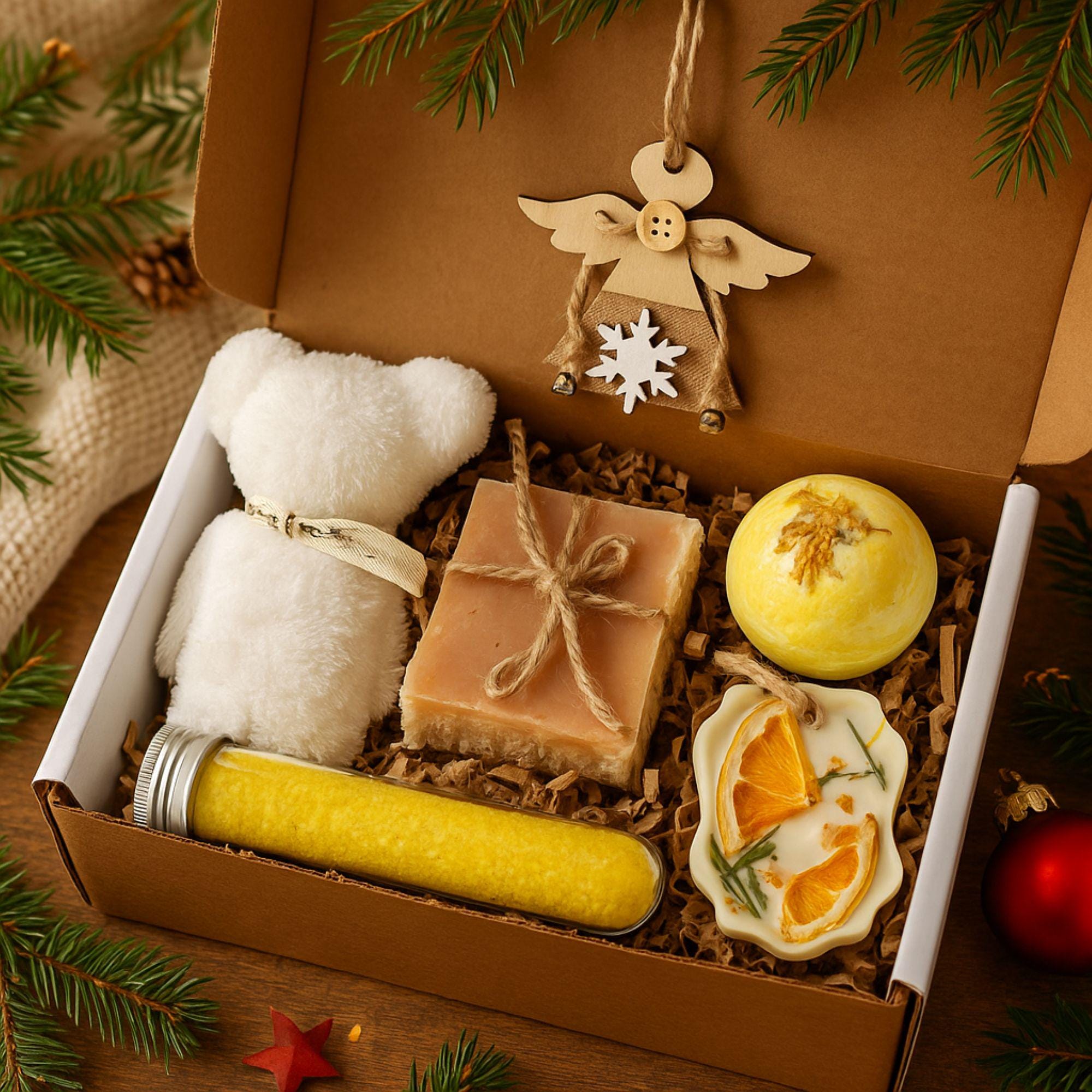 Christmas spa gift box for her with handmade soap, yellow bath bomb, citrus wax sachet, towel teddy bear, angel ornament, and aromatic bath salts. Cozy holiday self-care package for women, small Christmas gift, Secret Santa spa set, relaxation and pampering box for winter stress relief.