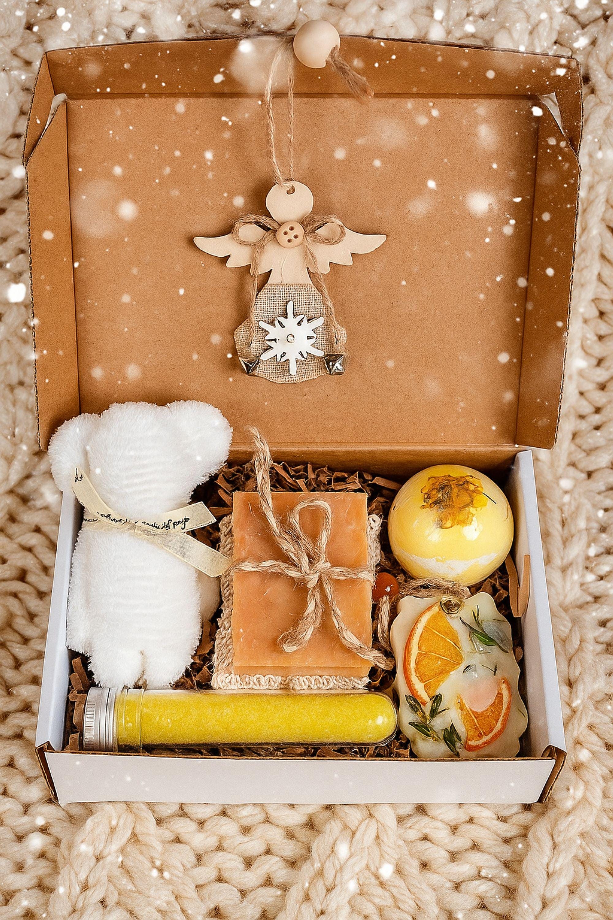 Christmas spa gift box for her with handmade soap, yellow bath bomb, citrus wax sachet, towel teddy bear, angel ornament, and aromatic bath salts. Cozy holiday self-care package for women, small Christmas gift, Secret Santa spa set, relaxation and pampering box for winter stress relief.