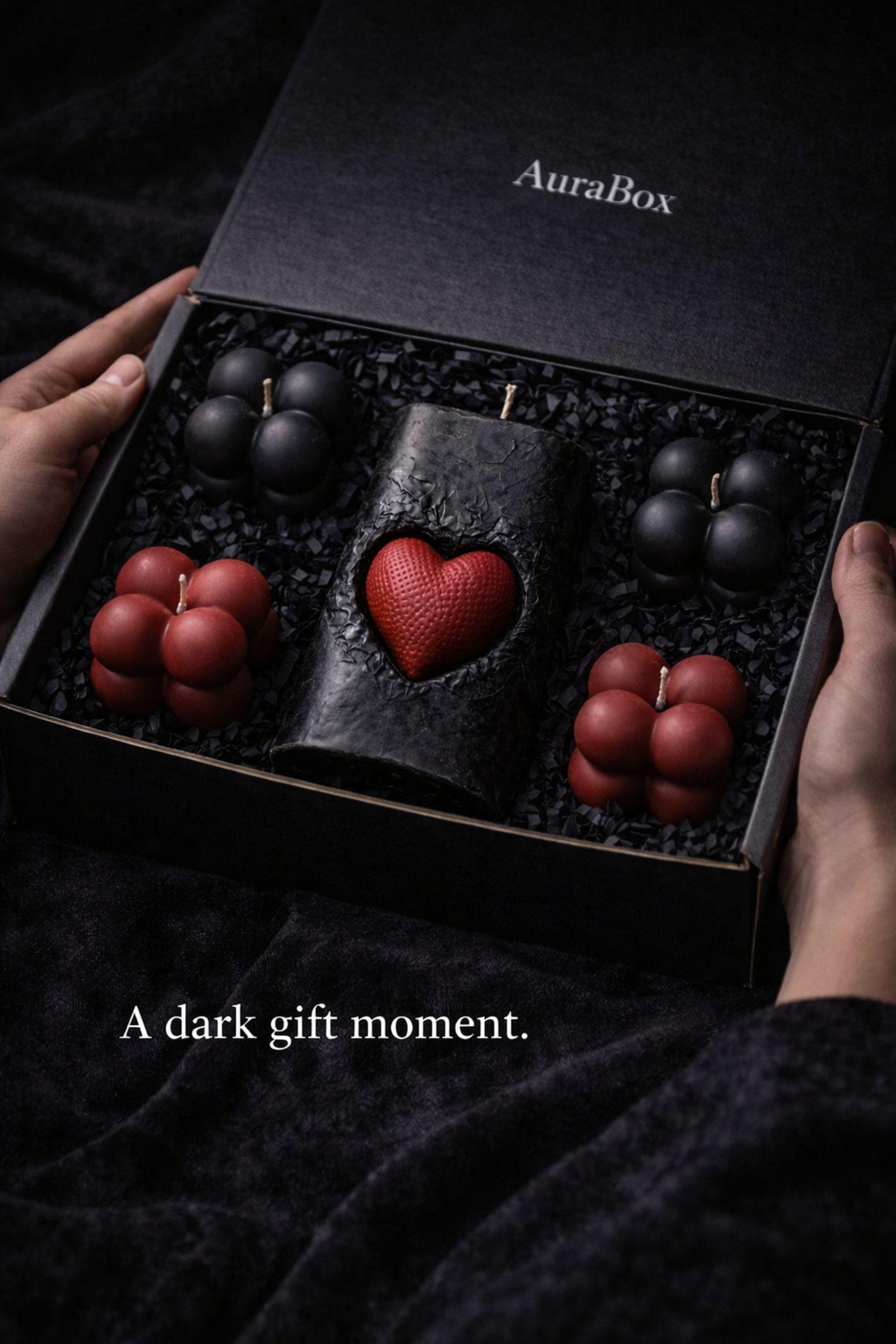 Gothic Sacred Heart Ritual Box featuring a handcrafted black candle with a red heart centerpiece and black and red bubble candles arranged in a dark gift box. This dark ritual candle set is designed for gothic home decor, witchy interiors, and alternative spiritual gifts. Unique handmade candle box with dramatic dark aesthetic, perfect for altar decor, shelves, or intentional spaces.