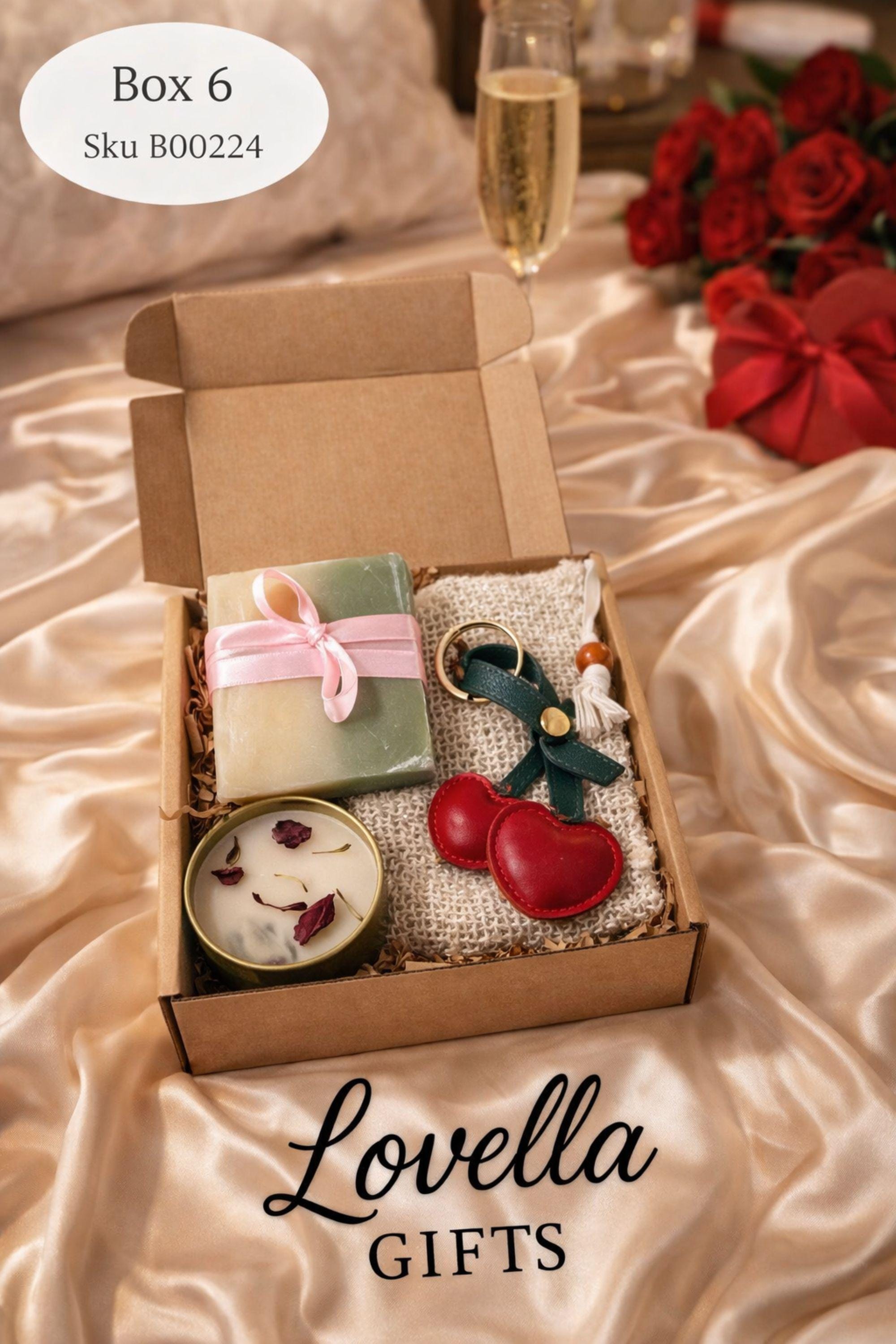 Cozy Valentine gift box with handmade soap tied with red ribbon, heart shaped candle, scented candle with dried flowers, bath salts in glass tubes, and knitted washcloth arranged in kraft gift box. Romantic self care gift for her, comfort care package, handmade Valentine’s Day gift, thinking of you box, ready to gift cozy relaxation set.
