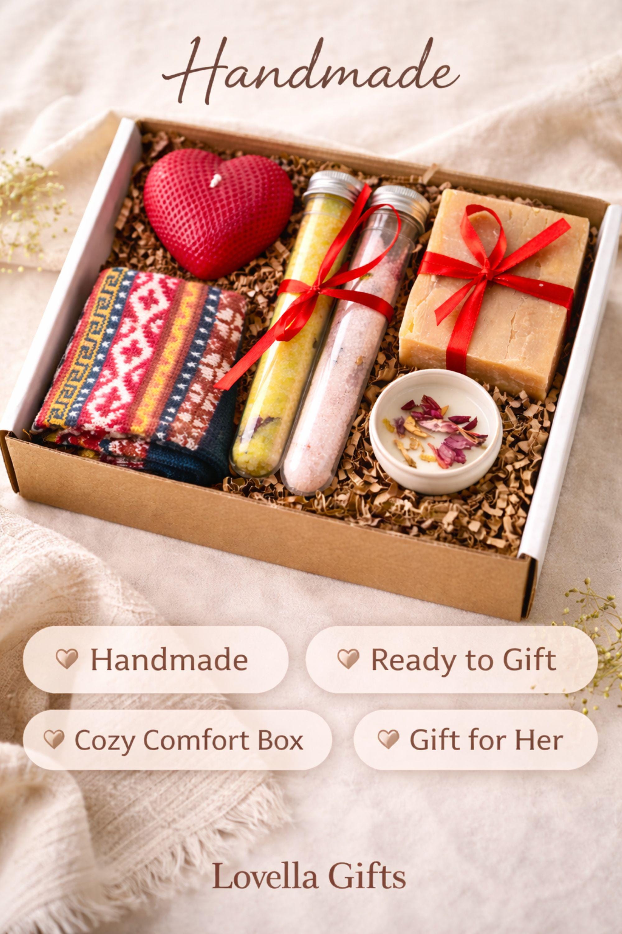 Cozy Valentine gift box with handmade soap tied with red ribbon, heart shaped candle, scented candle with dried flowers, bath salts in glass tubes, and knitted washcloth arranged in kraft gift box. Romantic self care gift for her, comfort care package, handmade Valentine’s Day gift, thinking of you box, ready to gift cozy relaxation set.