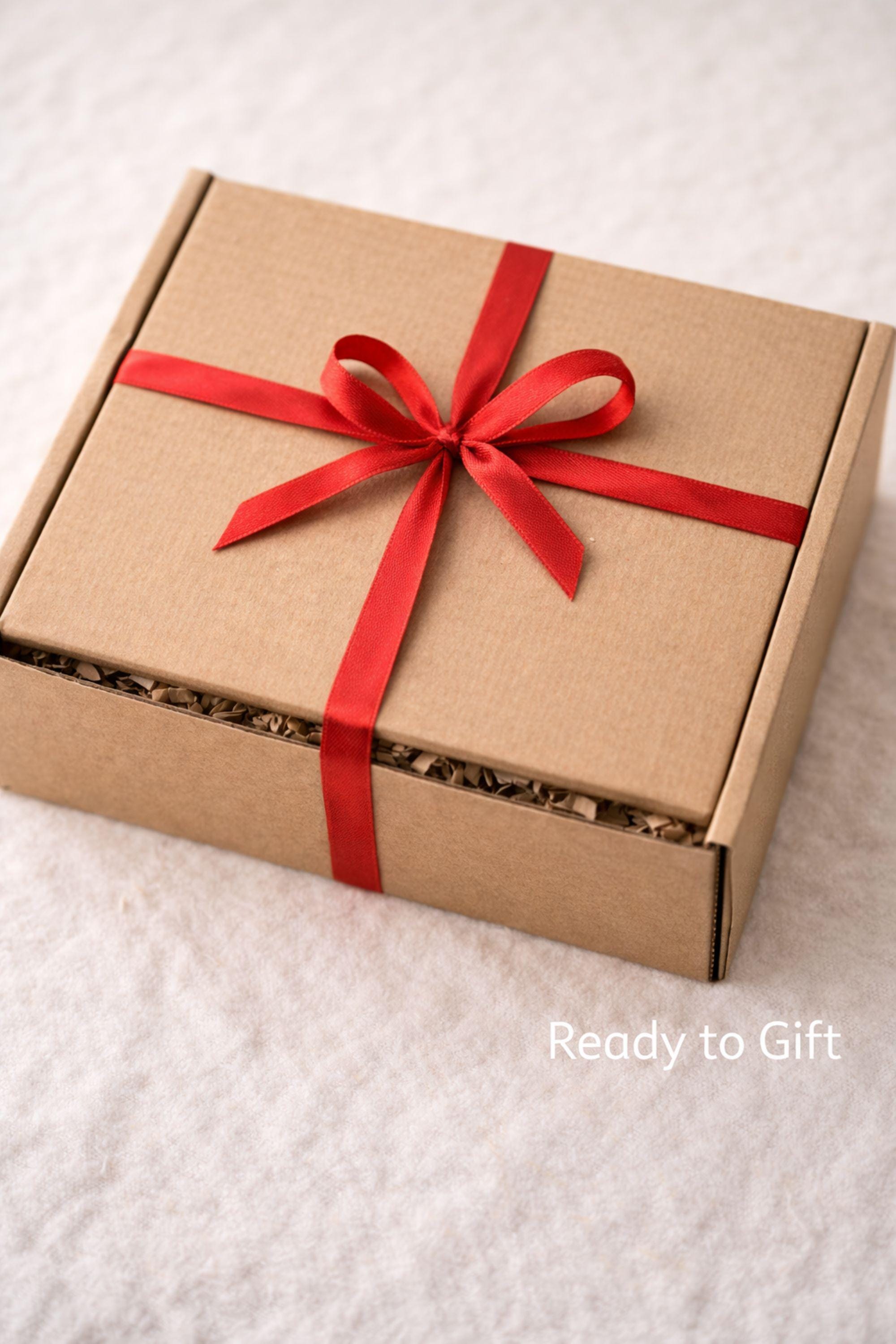 Cozy Valentine gift box with handmade soap tied with red ribbon, heart shaped candle, scented candle with dried flowers, bath salts in glass tubes, and knitted washcloth arranged in kraft gift box. Romantic self care gift for her, comfort care package, handmade Valentine’s Day gift, thinking of you box, ready to gift cozy relaxation set.