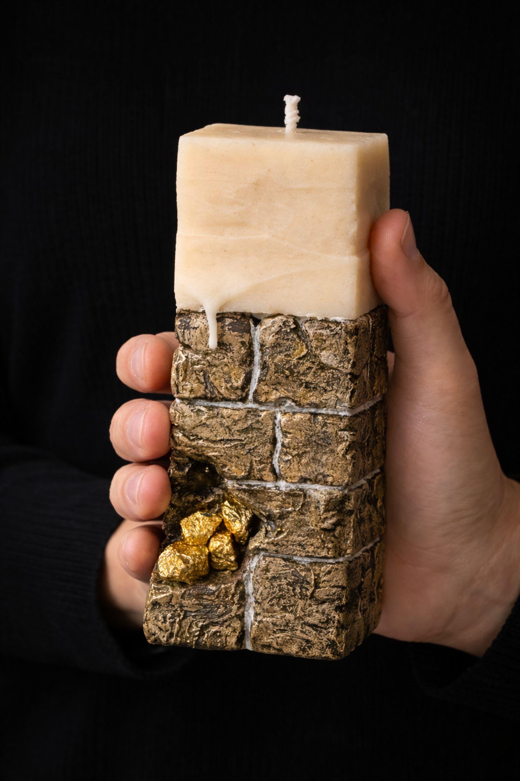 Luxury sculptural candle gift designed as a handmade wax art object for modern decor and unique gifting. Featuring a stone inspired textured base with subtle gold accents and an architectural form, this candle functions as both a decorative sculpture and functional candle. Ideal as a housewarming gift, designer candle gift, modern decor accent, or premium handmade present for design lovers who value craftsmanship, originality, and refined luxury interiors.