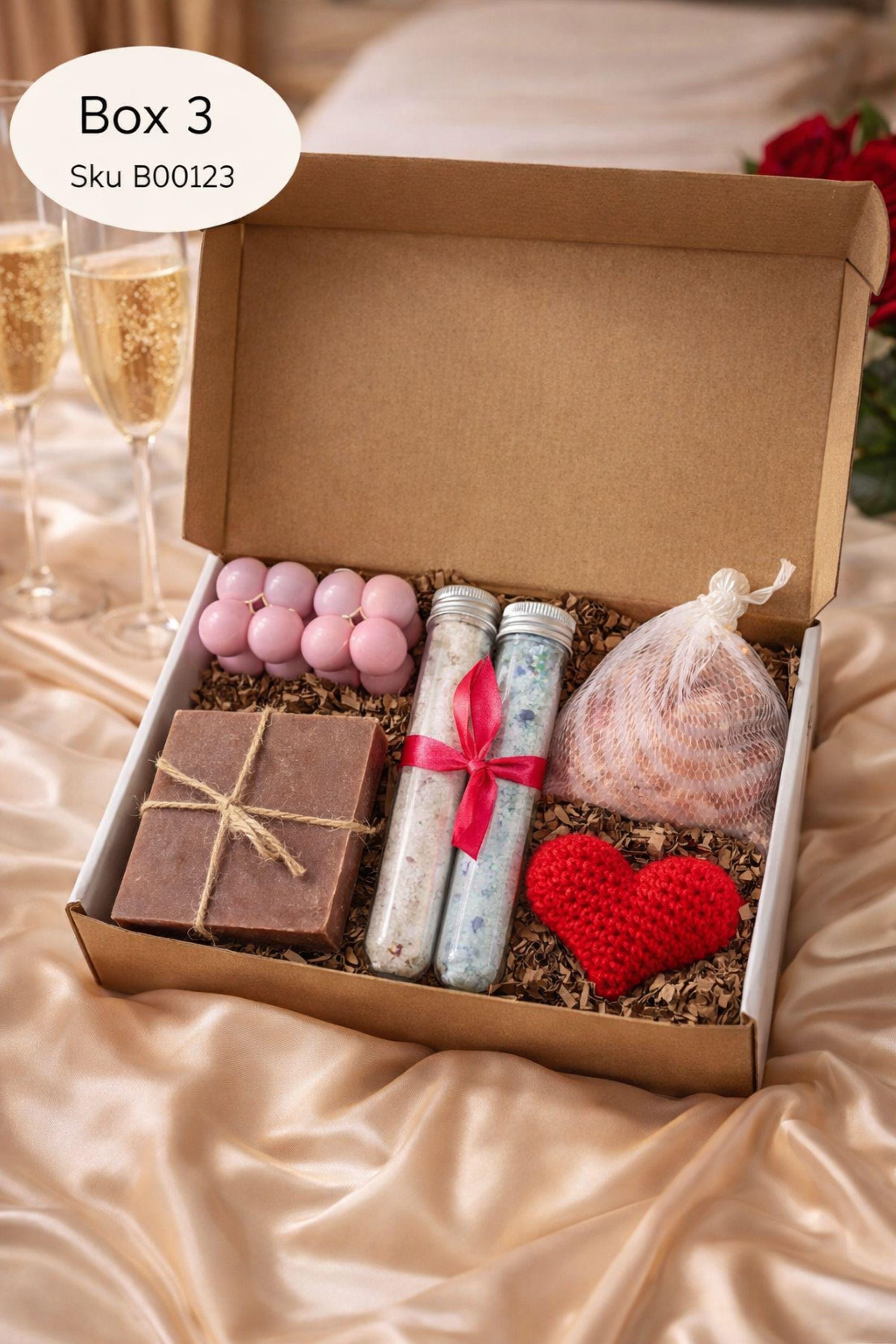 Self love Valentine spa gift box featuring two handmade bubble candles, artisan soap tied with twine, bath salts in glass tubes with ribbon, a crochet heart, and a decorative succulent in a gift box with shredded paper filler. Neutral and calming self care gift for women, ready to gift for Valentine’s Day, self love, thinking of you, or just because occasions. Handmade spa gift with cozy aesthetic.