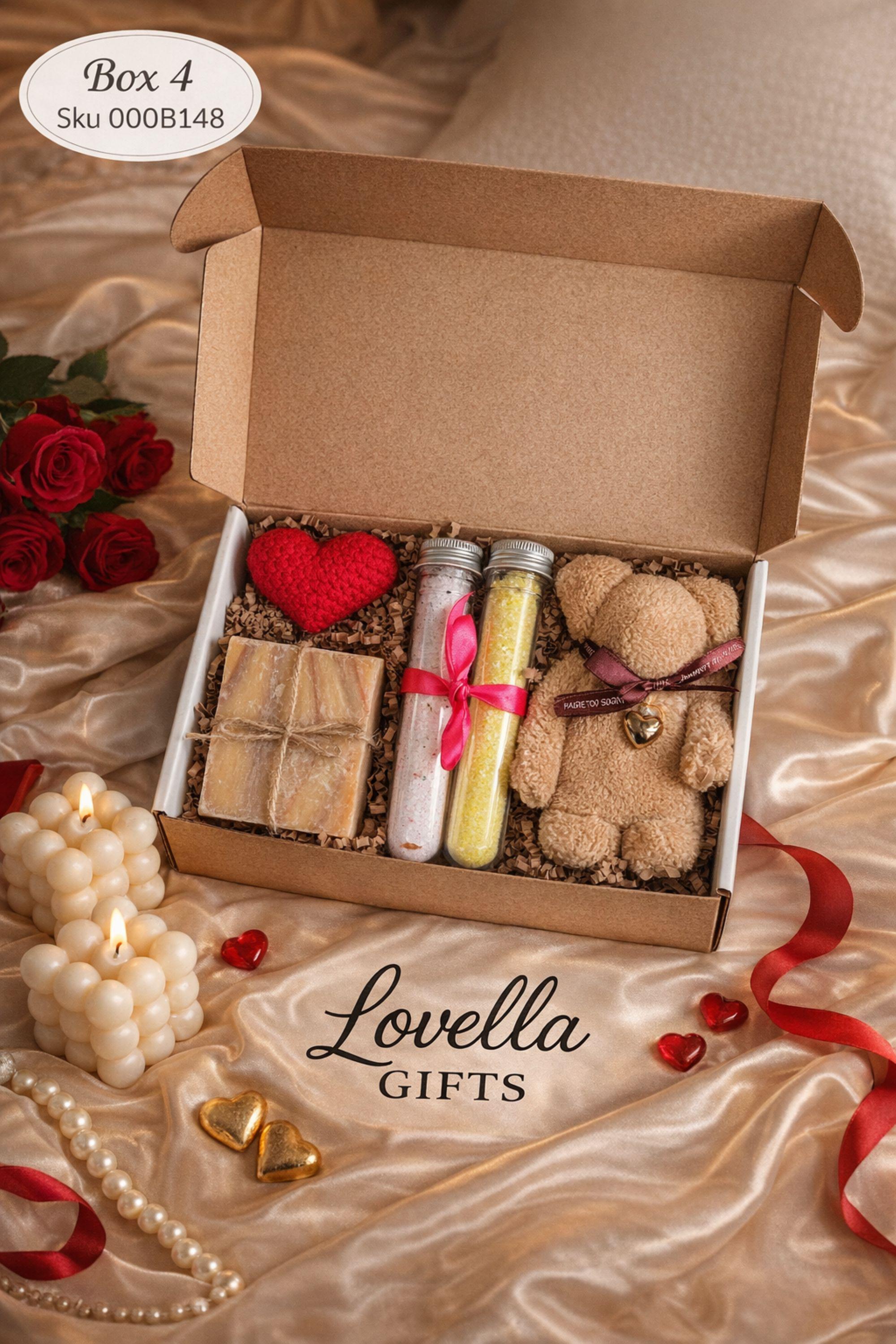 Self love Valentine spa gift box featuring two handmade bubble candles, artisan soap tied with twine, bath salts in glass tubes with ribbon, a crochet heart, and a decorative succulent in a gift box with shredded paper filler. Neutral and calming self care gift for women, ready to gift for Valentine’s Day, self love, thinking of you, or just because occasions. Handmade spa gift with cozy aesthetic.