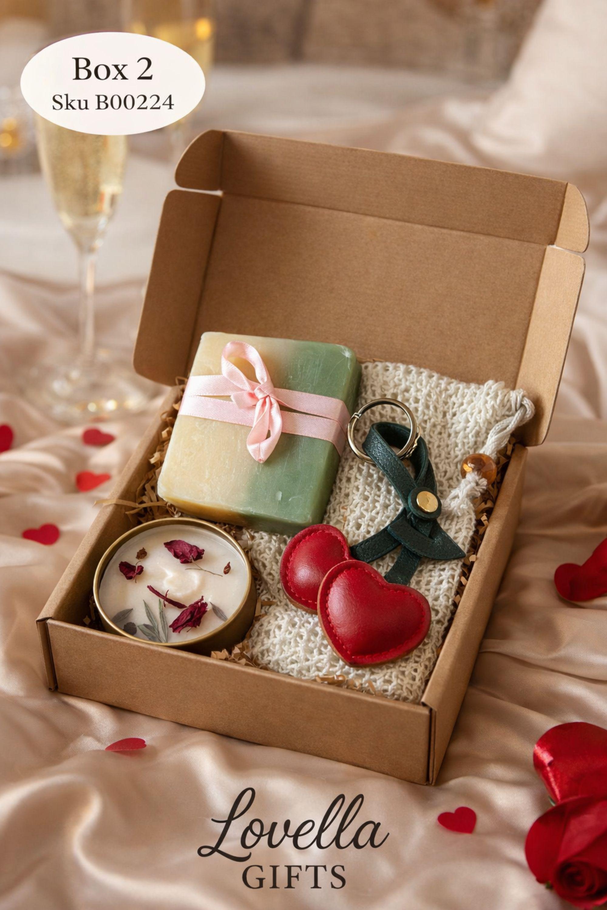 Thinking of you gift box with handmade soap tied with red ribbon, botanical candle in metal tin, wax sachet with dried flowers and crochet flower arranged inside a black gift box. Cozy comfort handmade gift for her, just because care package, small meaningful present for long distance support, encouragement, sympathy or thoughtful gesture. Gift ready handmade box designed to show care, warmth and attention.