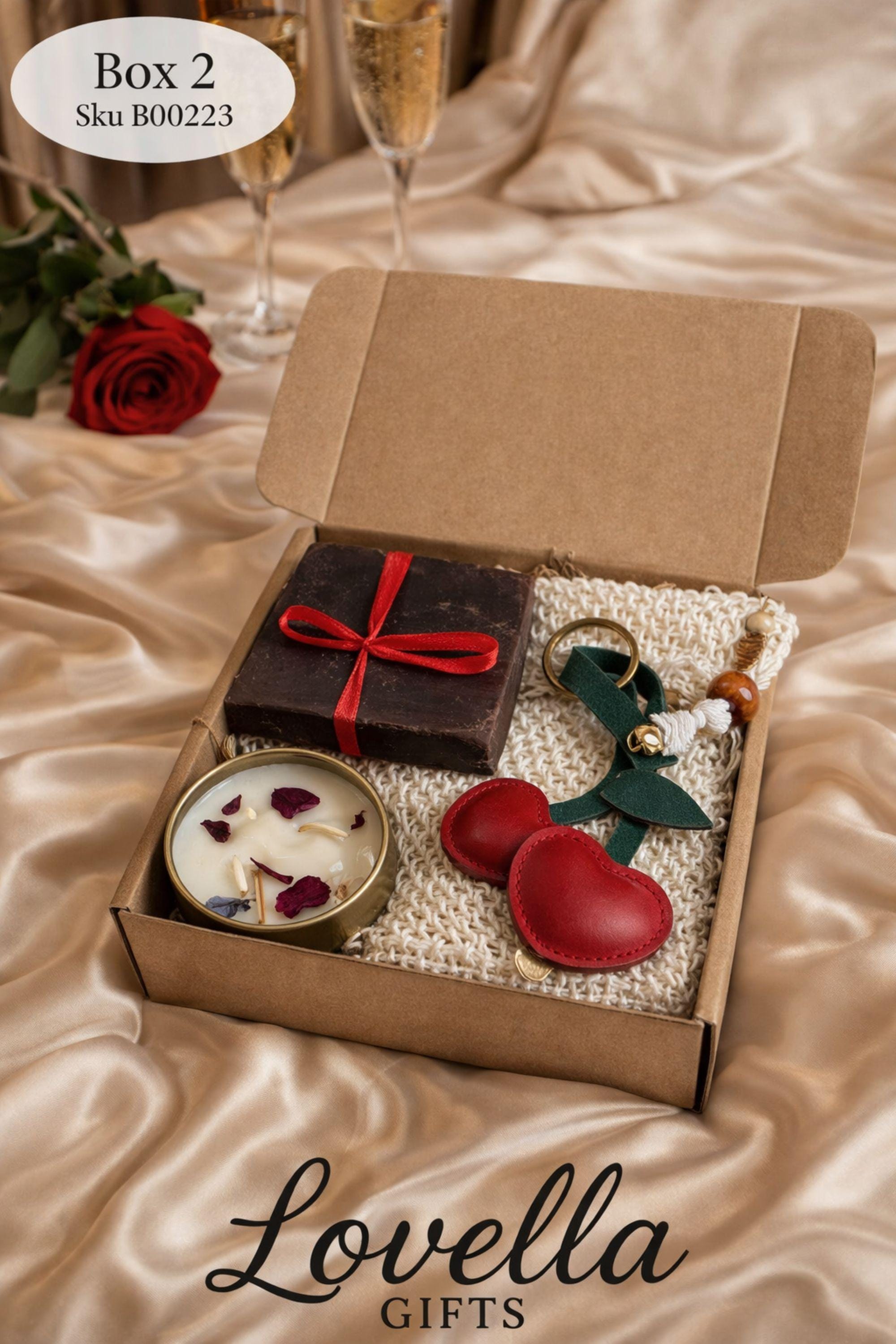 Valentine gift box for her displayed open in a kraft box, featuring handmade sage bubble candles, natural soap tied with a soft ribbon, and two glass tubes of bath salts arranged neatly with filler. Calm Valentine care package designed in soothing green and neutral tones, perfect as a gentle handmade Valentine gift, comfort box, or thoughtful alternative to traditional romantic presents.