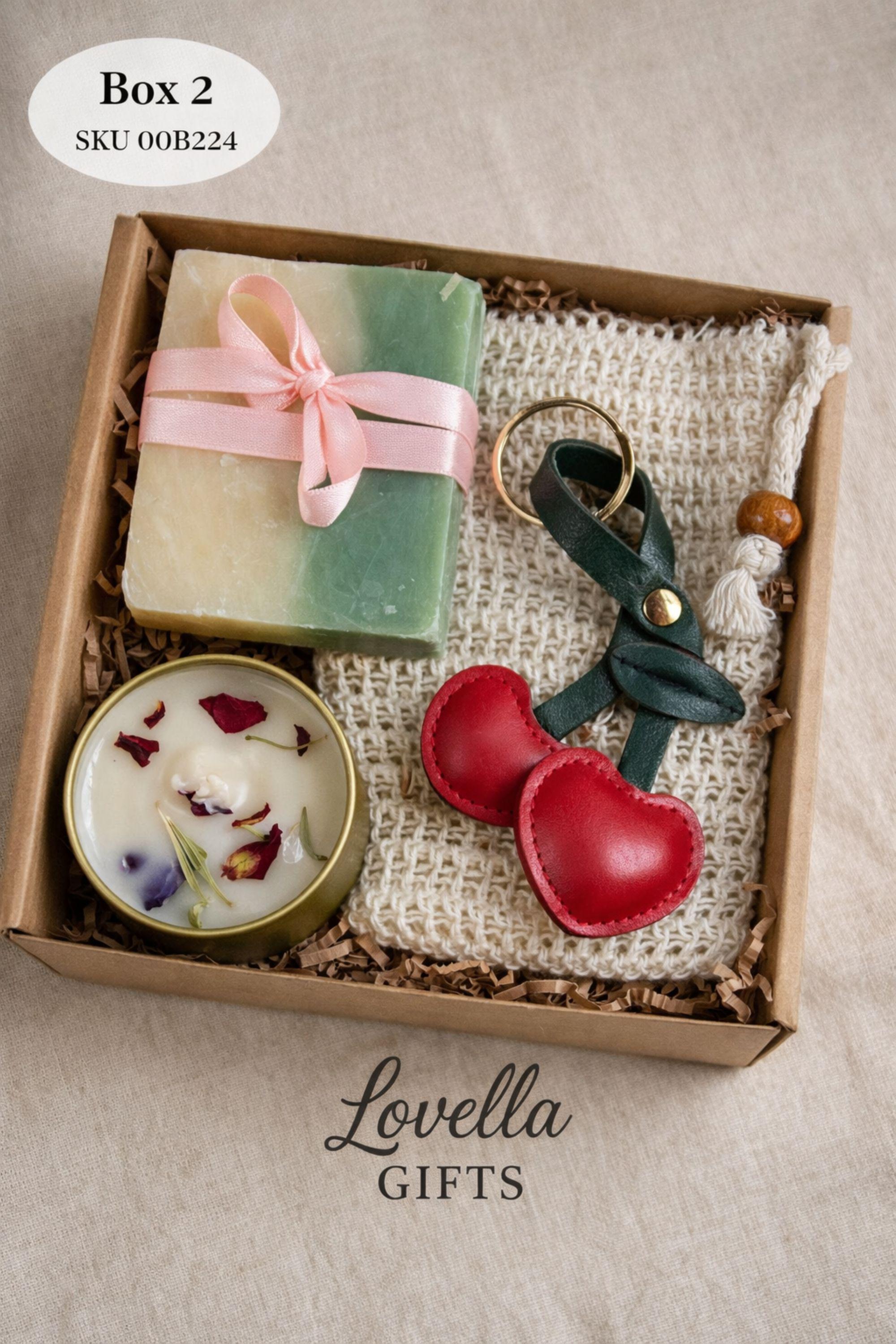 Open minimalist gift box styled in a serene home environment with neutral tones, featuring handmade sage candles, soap, and bath salts. Cozy home gift set designed for everyday calm, slow living, and simple self care routines, offering a peaceful handmade candle and soap set that fits naturally into a minimalist interior.