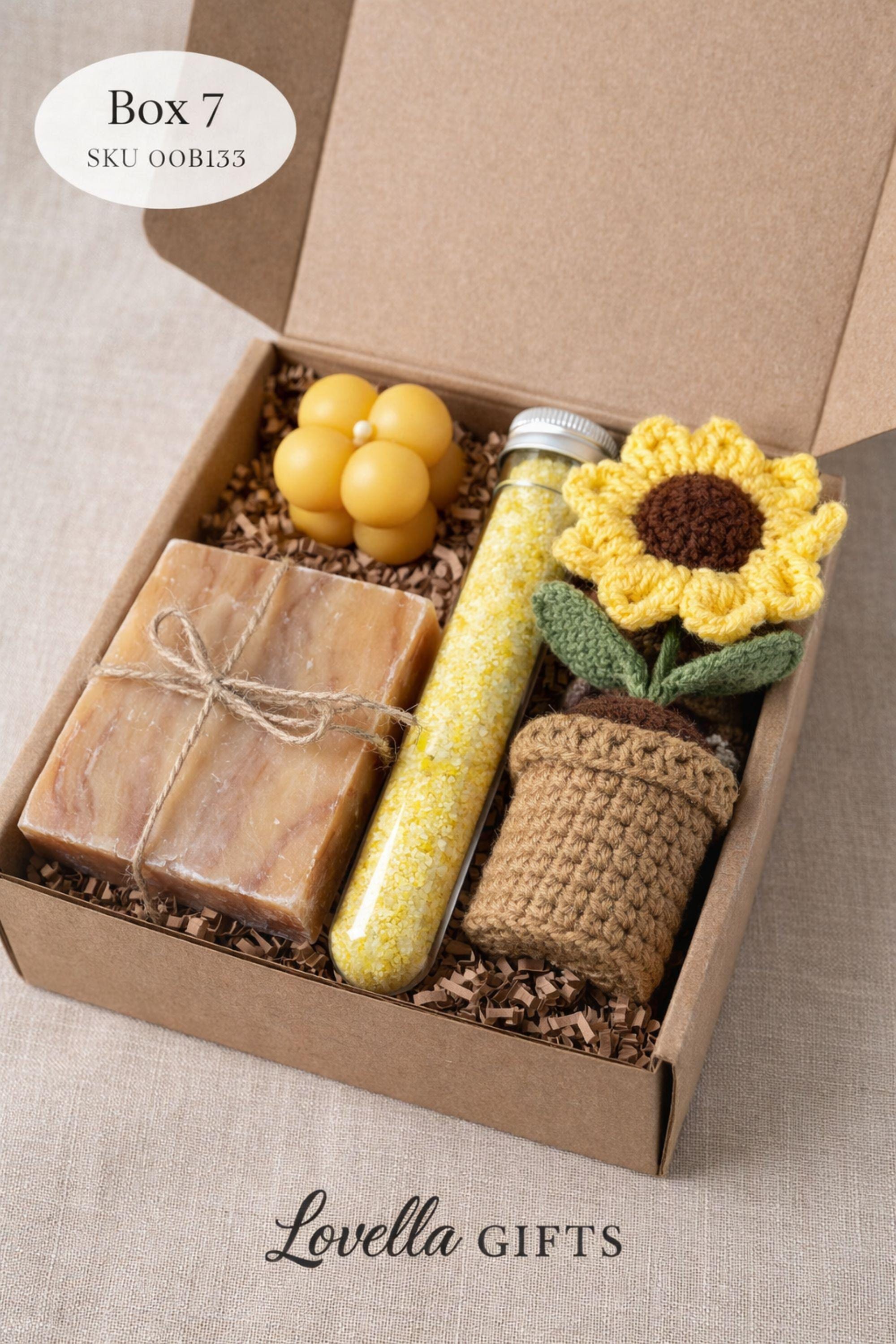 Open handmade gift box for mom displayed on a neutral surface, showing a cozy arrangement of colorful bubble candle, natural soap tied with twine, and one glass tubes of bath salt and crochet sunflower inside a small 6x6 inch kraft box. Thoughtful gift for mom featuring warm colors and handmade details, designed as a cozy, ready-to-gift present for birthdays, appreciation, or everyday gifting.