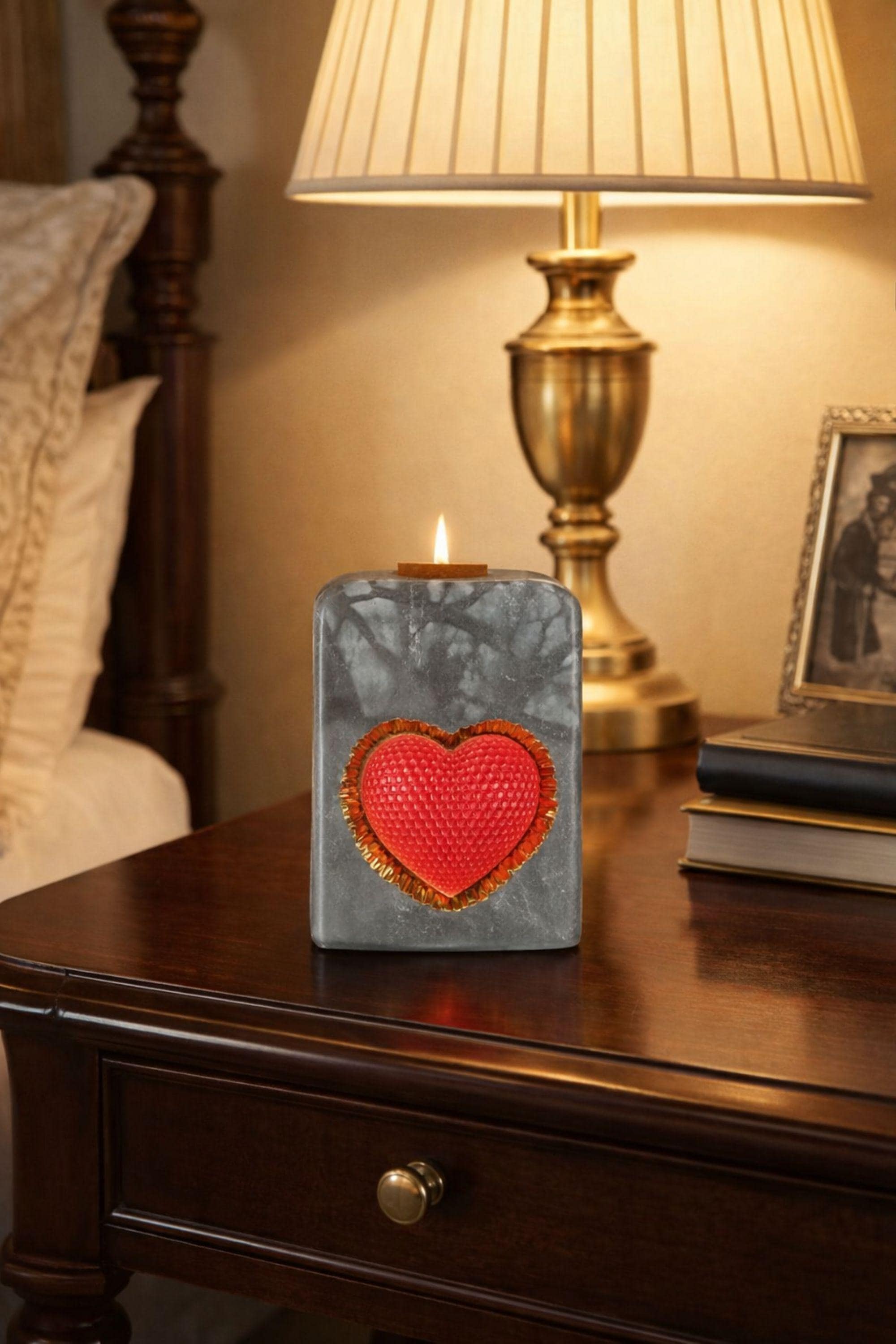 Luxury grey statement candle with a red textured heart framed in gold, handcrafted designer candle created as a romantic gift and modern decor object. This luxury heart candle is designed as a meaningful anniversary or Valentine’s gift for her, combining sculptural form, stone-inspired texture, and gold detail for a centerpiece candle look.