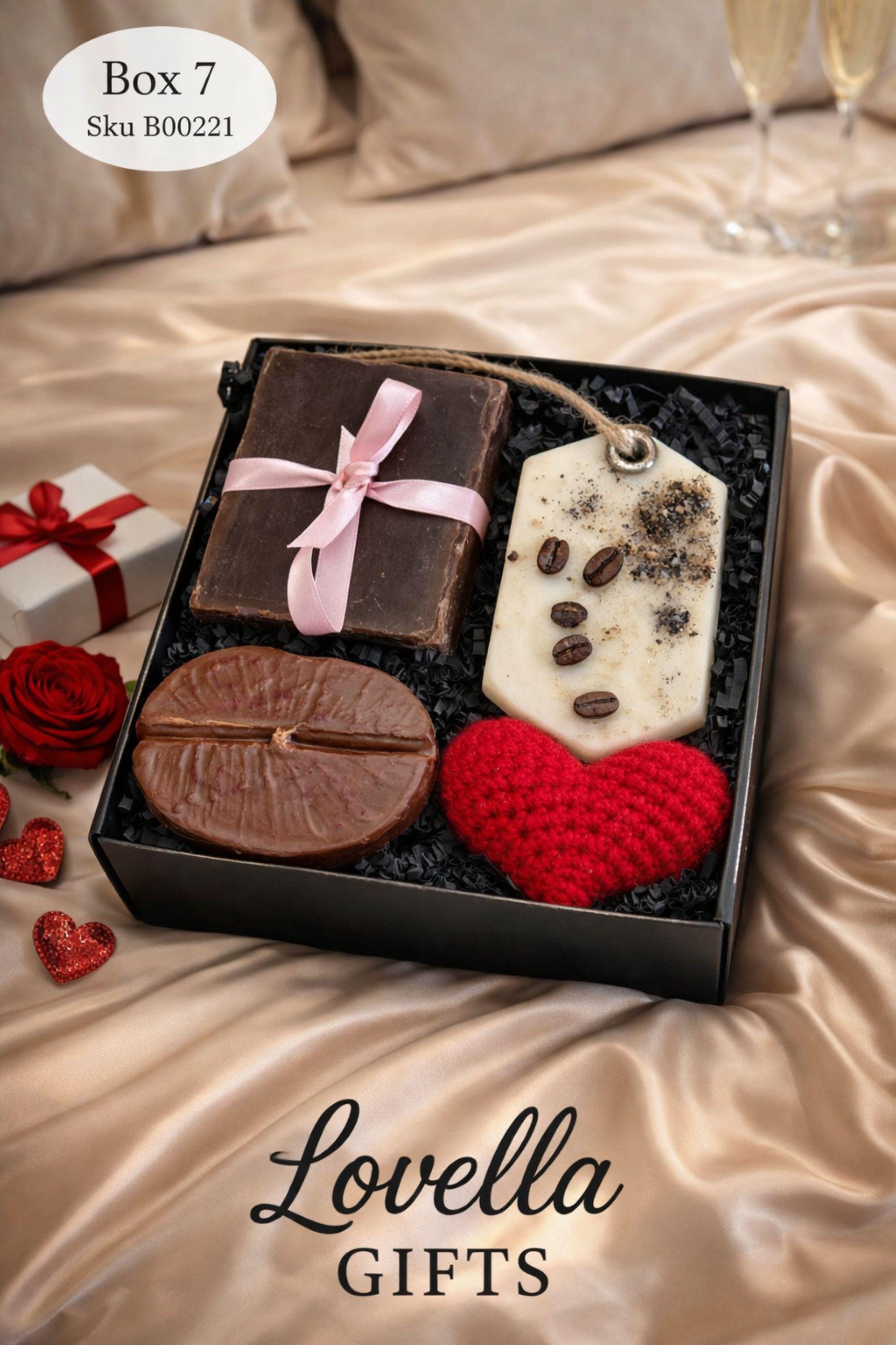 Cozy Valentine gift box with handmade soap tied with red ribbon, heart shaped candle, scented candle with dried flowers, bath salts in glass tubes, and knitted washcloth arranged in kraft gift box. Romantic self care gift for her, comfort care package, handmade Valentine’s Day gift, thinking of you box, ready to gift cozy relaxation set.