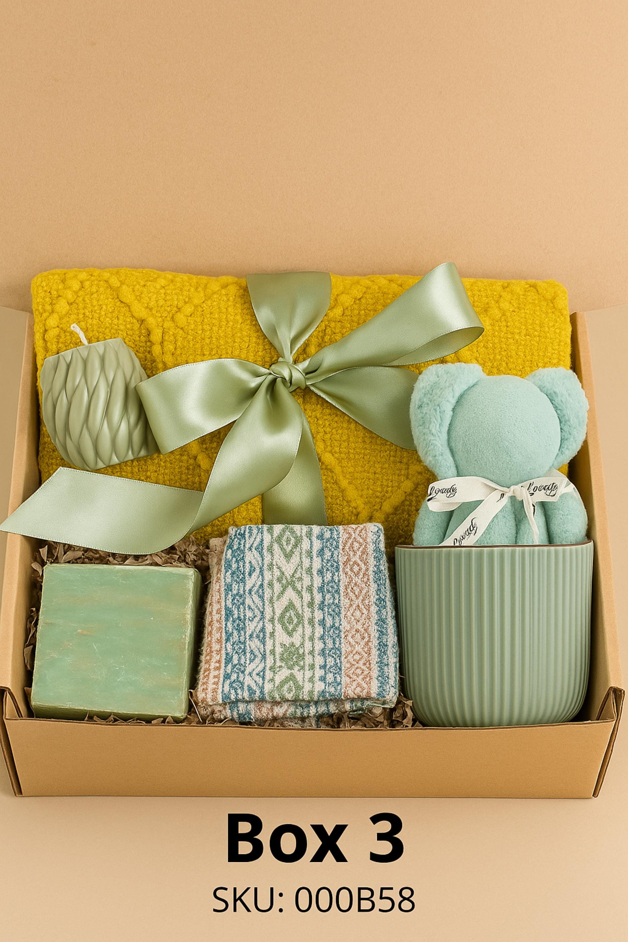Self Love Reset gift box for women displayed on warm neutral linen background with soft window light, featuring yellow knit blanket, handmade natural soap, pastel bubble candles, citrus wax tablet with dried orange slices, ceramic mug and wooden soap dish. Emotional healing care package for new beginnings, self care gift for her, breakup recovery support box, thoughtful reset present.