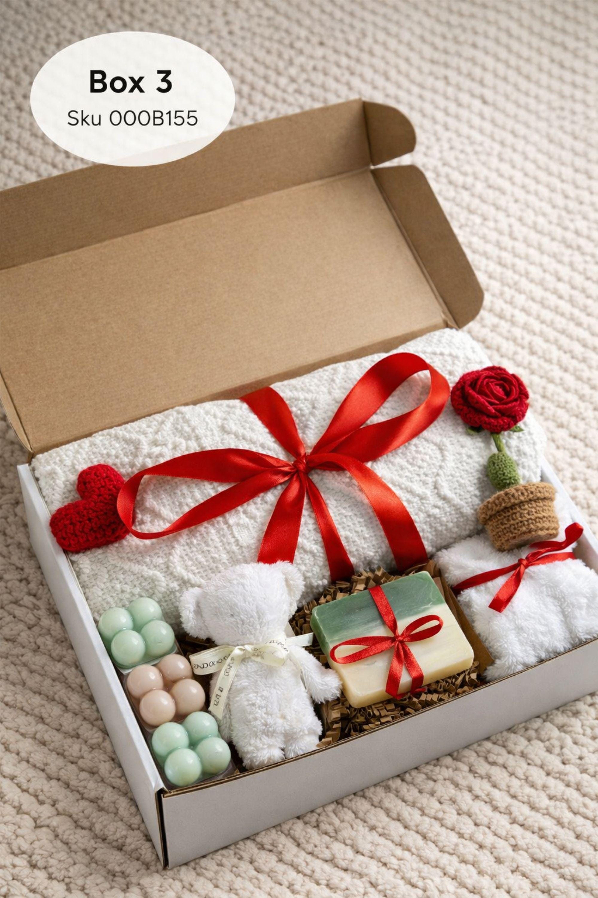 Cozy Valentine gift box for her displayed on a soft cream knitted background, featuring handmade bubble candles, a heart-shaped artisan soap, plush cozy bear, and spa-inspired self care items arranged in a gift-ready box. This romantic Valentine care package is a thoughtful self care gift for girlfriend, wife, sister, or loved one, designed to send comfort, warmth, and love with handmade details and ready-to-gift packaging.