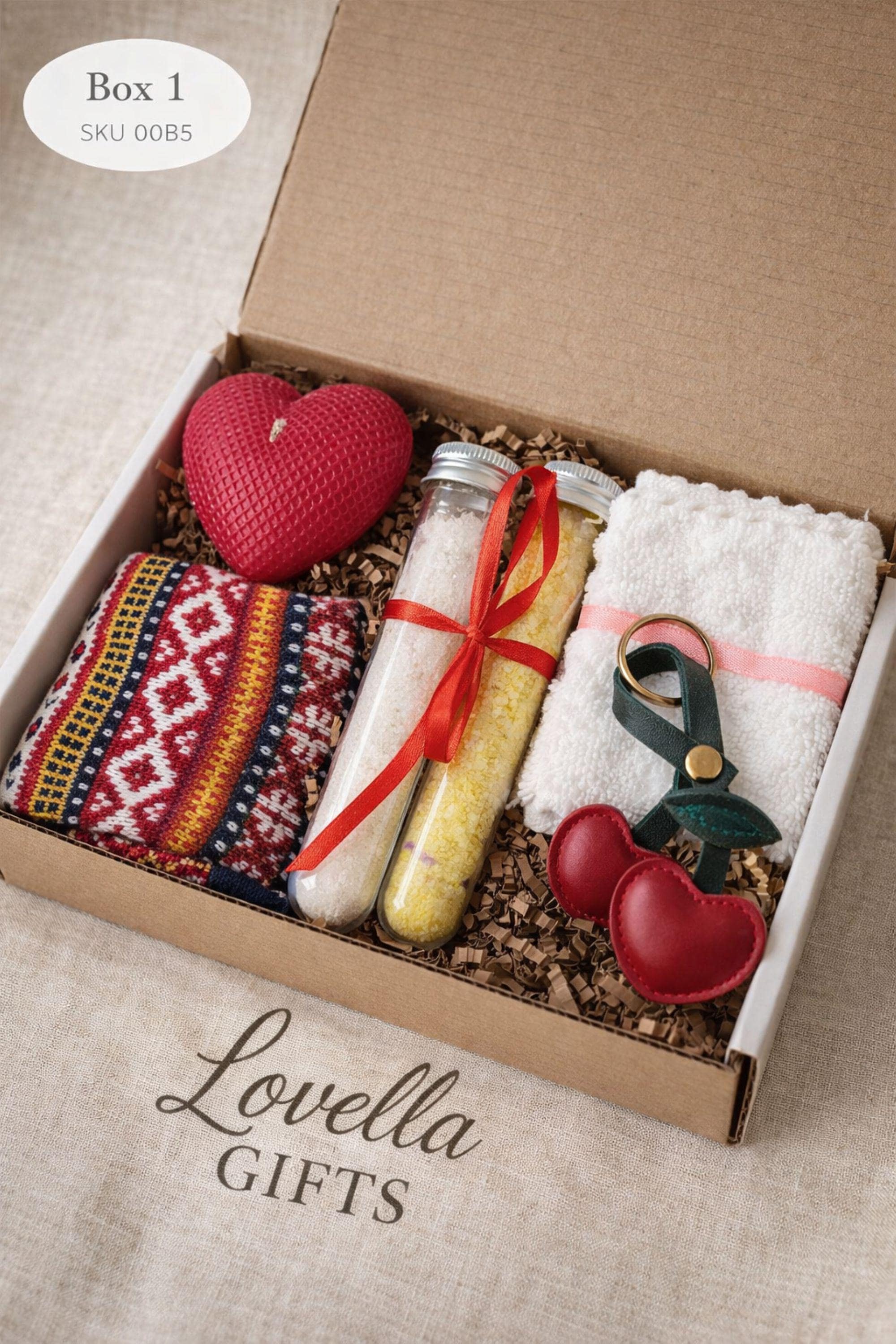 Valentines gift box shown open with a heart shaped candle, handmade soap tied with red ribbon, and two glass tubes filled with bath salts arranged inside a small kraft box. This romantic Valentine’s Day care package is designed as a cozy and thoughtful gift, perfect for surprising someone special with a handmade valentine present that feels warm, meaningful, and ready to give.