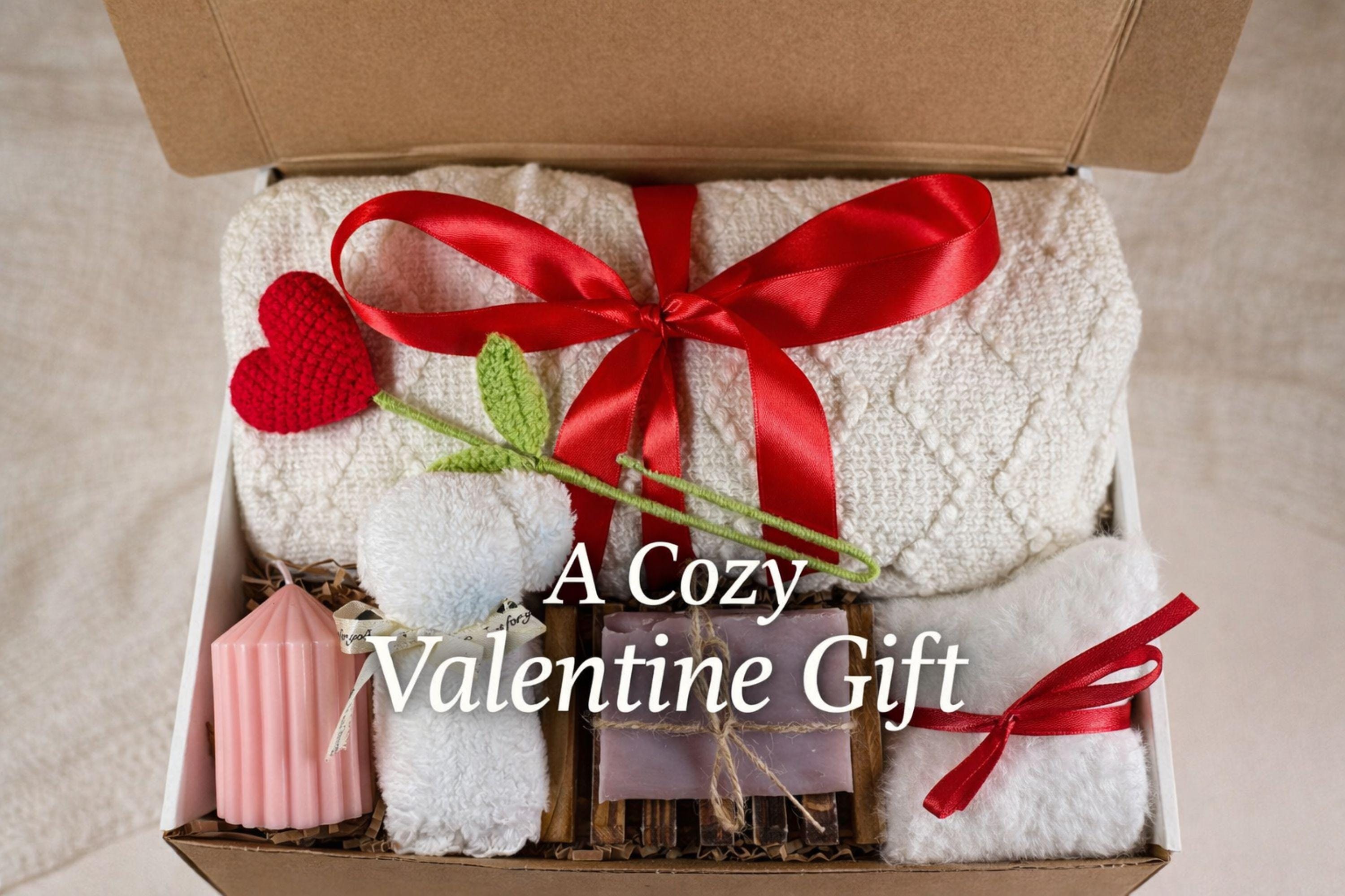 Valentine gift box with soft cozy blanket, candle, handmade soap, plush comfort items, and romantic heart details arranged in a gift-ready box. This cozy romantic Valentine care package is designed to send love, warmth, and comfort, perfect for long distance Valentine gifting, self love moments, or a thoughtful romantic surprise for her.