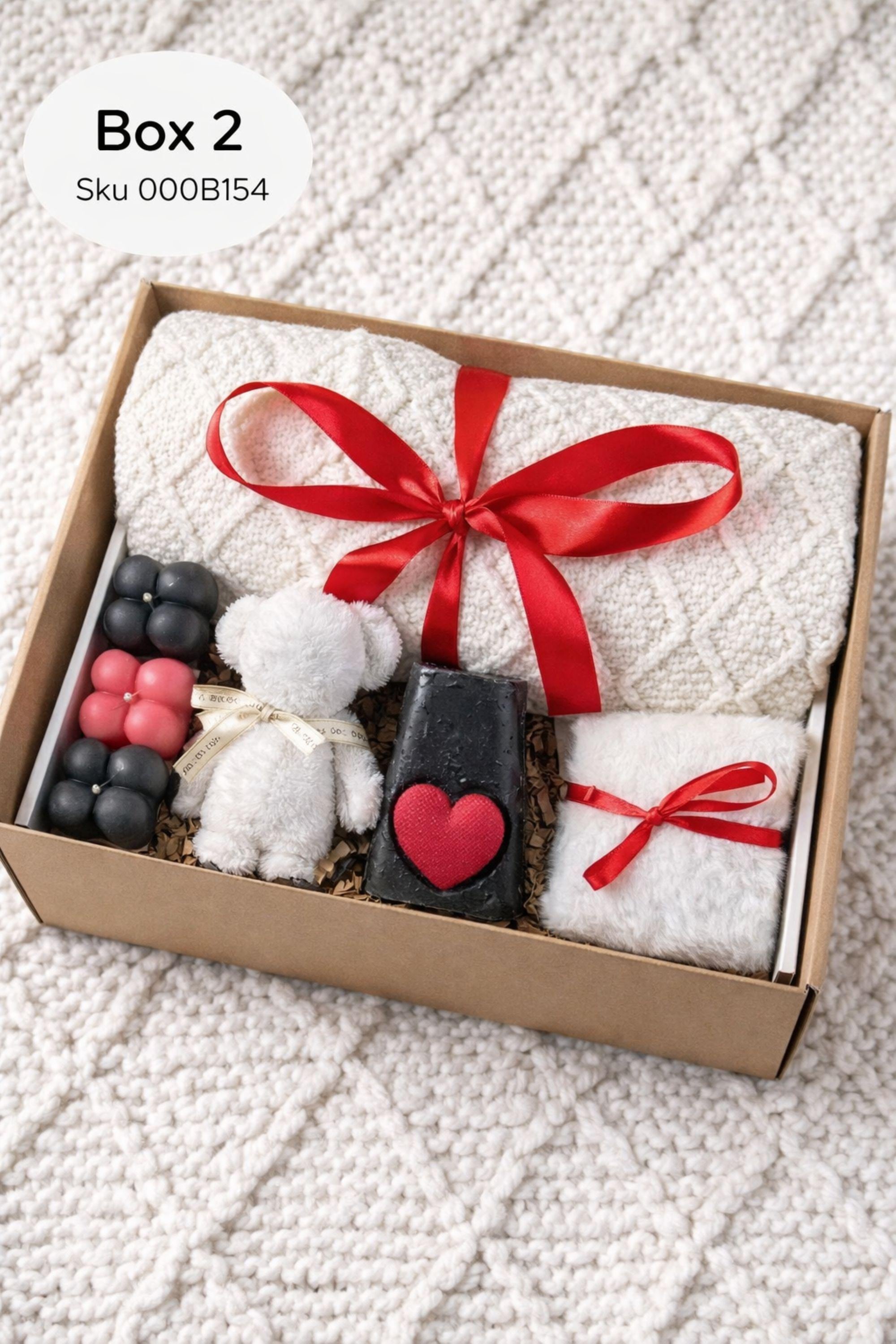Valentine gift box with soft cozy blanket, candle, handmade soap, plush comfort items, and romantic heart details arranged in a gift-ready box. This cozy romantic Valentine care package is designed to send love, warmth, and comfort, perfect for long distance Valentine gifting, self love moments, or a thoughtful romantic surprise for her.