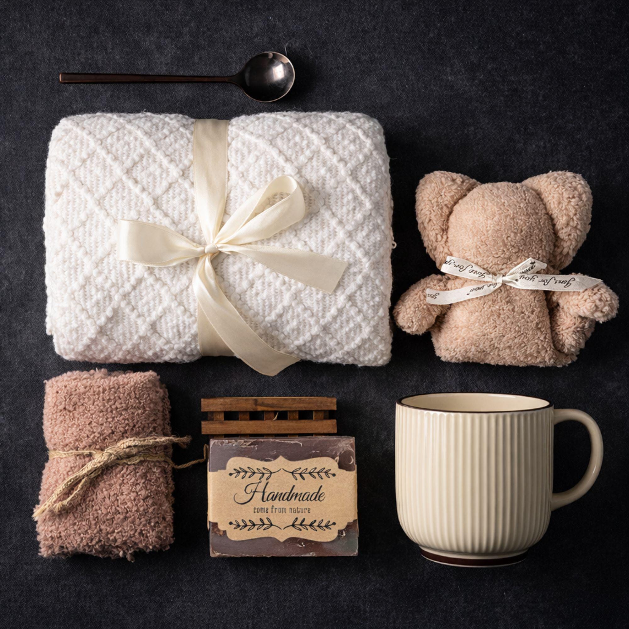 Loss of mother sympathy gift box with cozy blanket, mug, handmade soap, wooden tray, soft socks and comfort items arranged in kraft box. Bereavement care package for condolence support and memorial present. Thoughtful grief support gift for loss of mom, funeral comfort box, remembrance gesture sent directly to recipient. Elegant sympathy present designed to provide warmth and quiet comfort during difficult time.