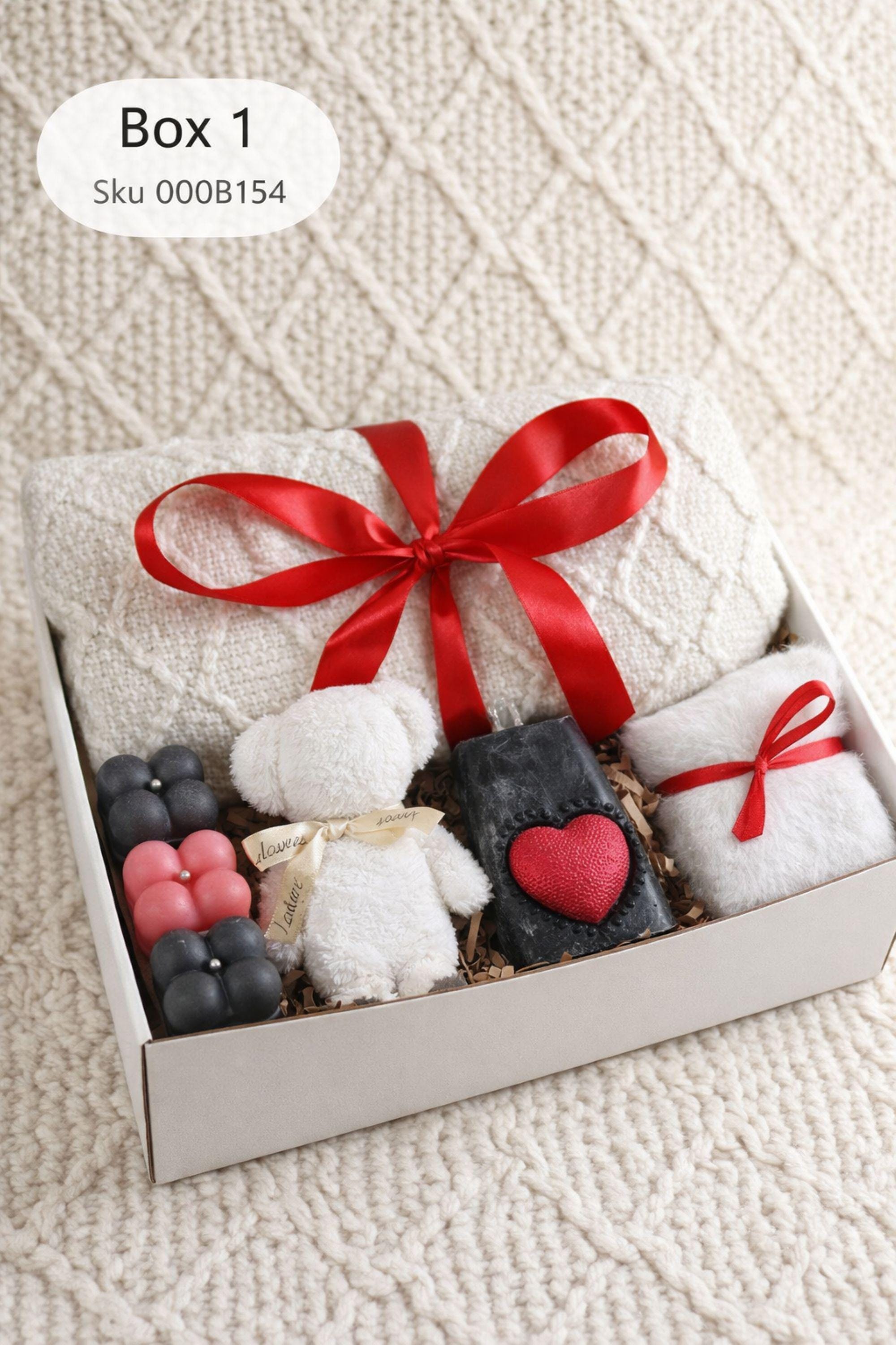 Cozy Valentine gift box for her displayed on a soft cream knitted background, featuring handmade bubble candles, a heart-shaped artisan soap, plush cozy bear, and spa-inspired self care items arranged in a gift-ready box. This romantic Valentine care package is a thoughtful self care gift for girlfriend, wife, sister, or loved one, designed to send comfort, warmth, and love with handmade details and ready-to-gift packaging.