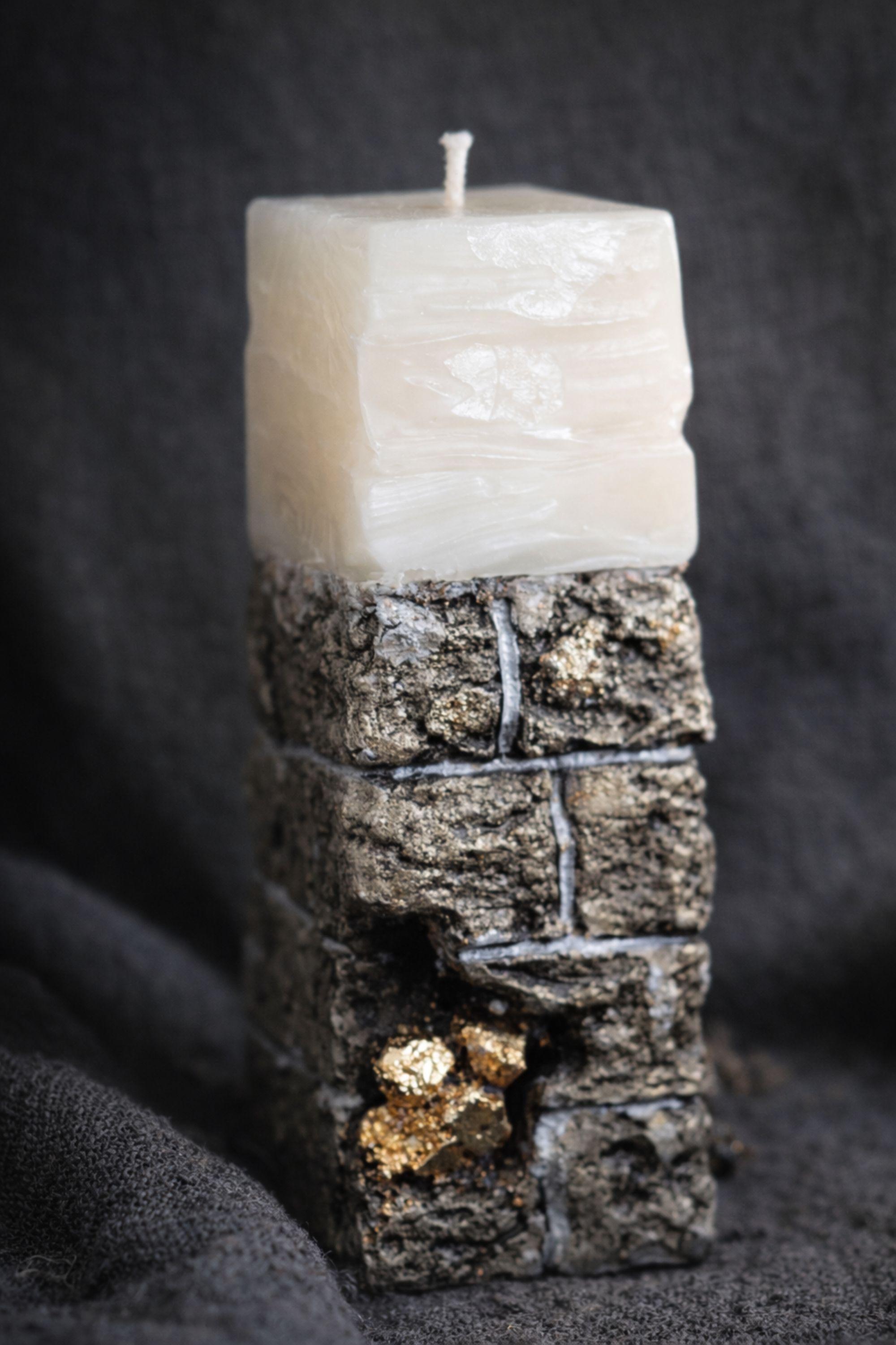 Sympathy gift box for loss of husband displayed on mouse grey linen background, open white 10x13x5 comfort care package featuring handmade 24K textured candle with stone base, cozy knit blanket tied with satin ribbon, cream ceramic mug with spoon, natural handmade soap on wooden holder, and rustic crinkle paper filler. Bereavement gift for grieving wife, condolence present, memorial comfort box, grief support package designed to send love and healing.