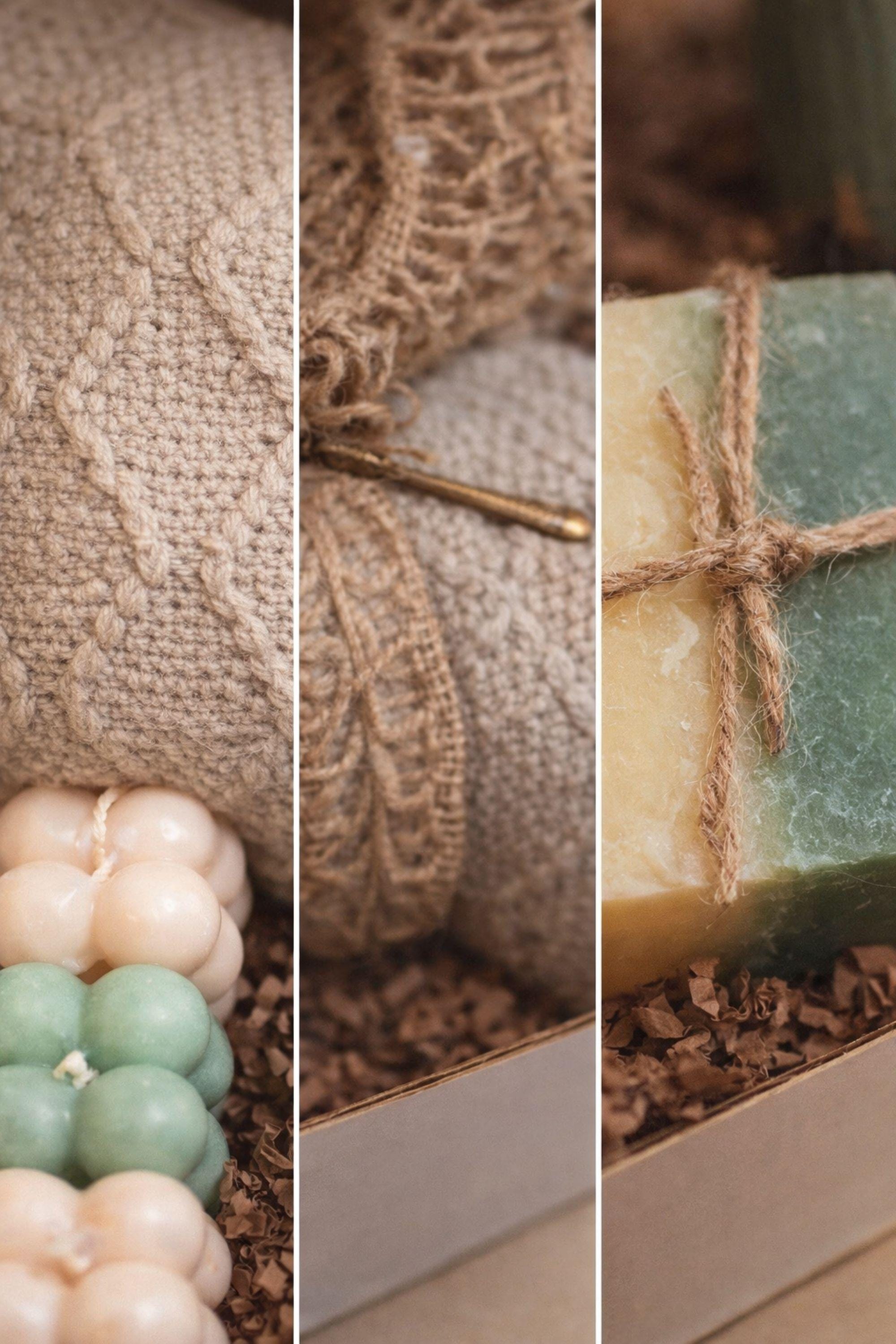 Sending You Hugs grief support gift box with sage knit blanket, ribbed green ceramic mug, handmade two-tone artisan soap, stainless steel spoon, and three bubble candles arranged inside kraft box on warm beige linen background. Sympathy care package designed for comfort during difficult times, loss support, thinking of you gift, and emotional encouragement.